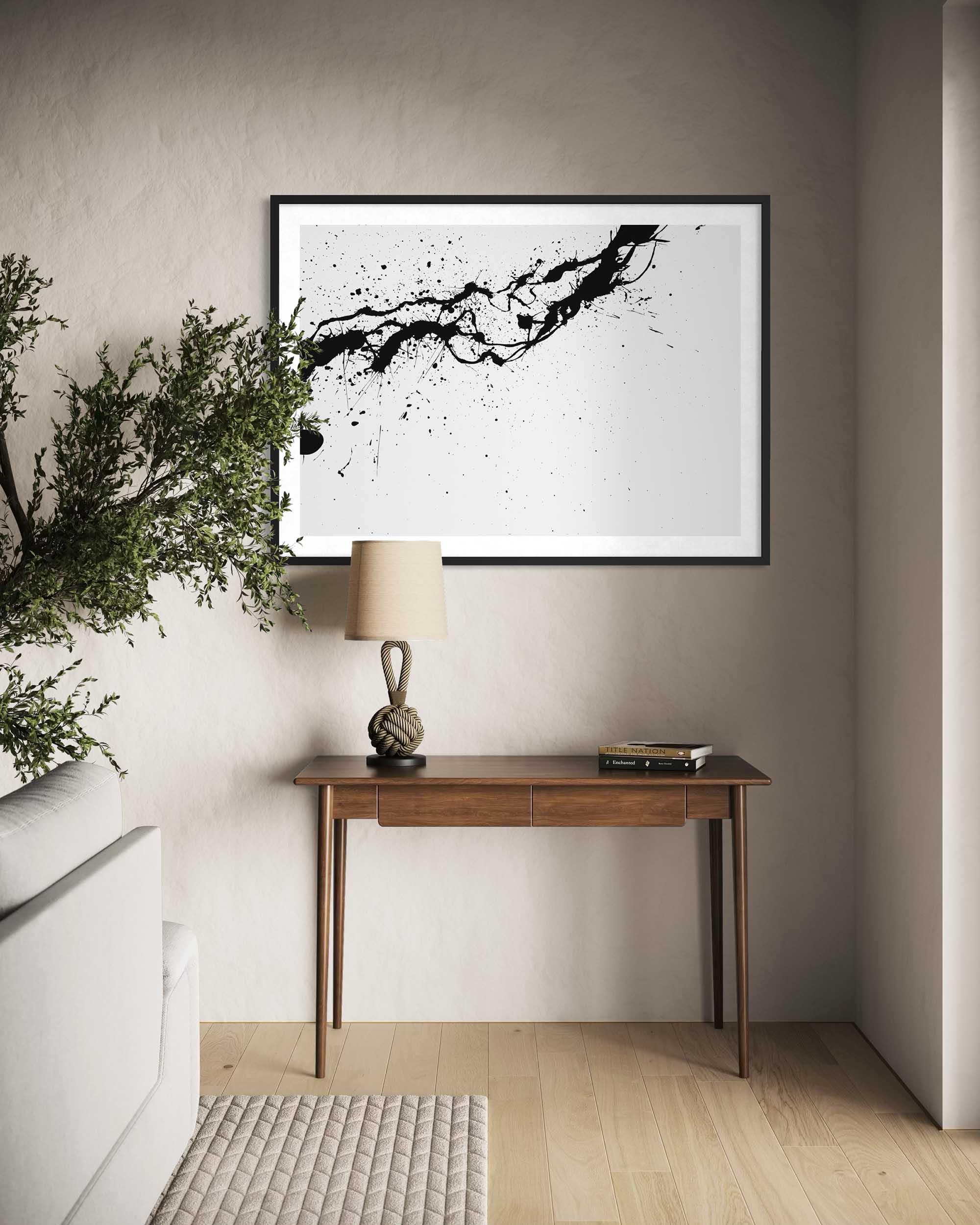 Modern interior with a wooden console table, lamp, and abstract art on the wall.