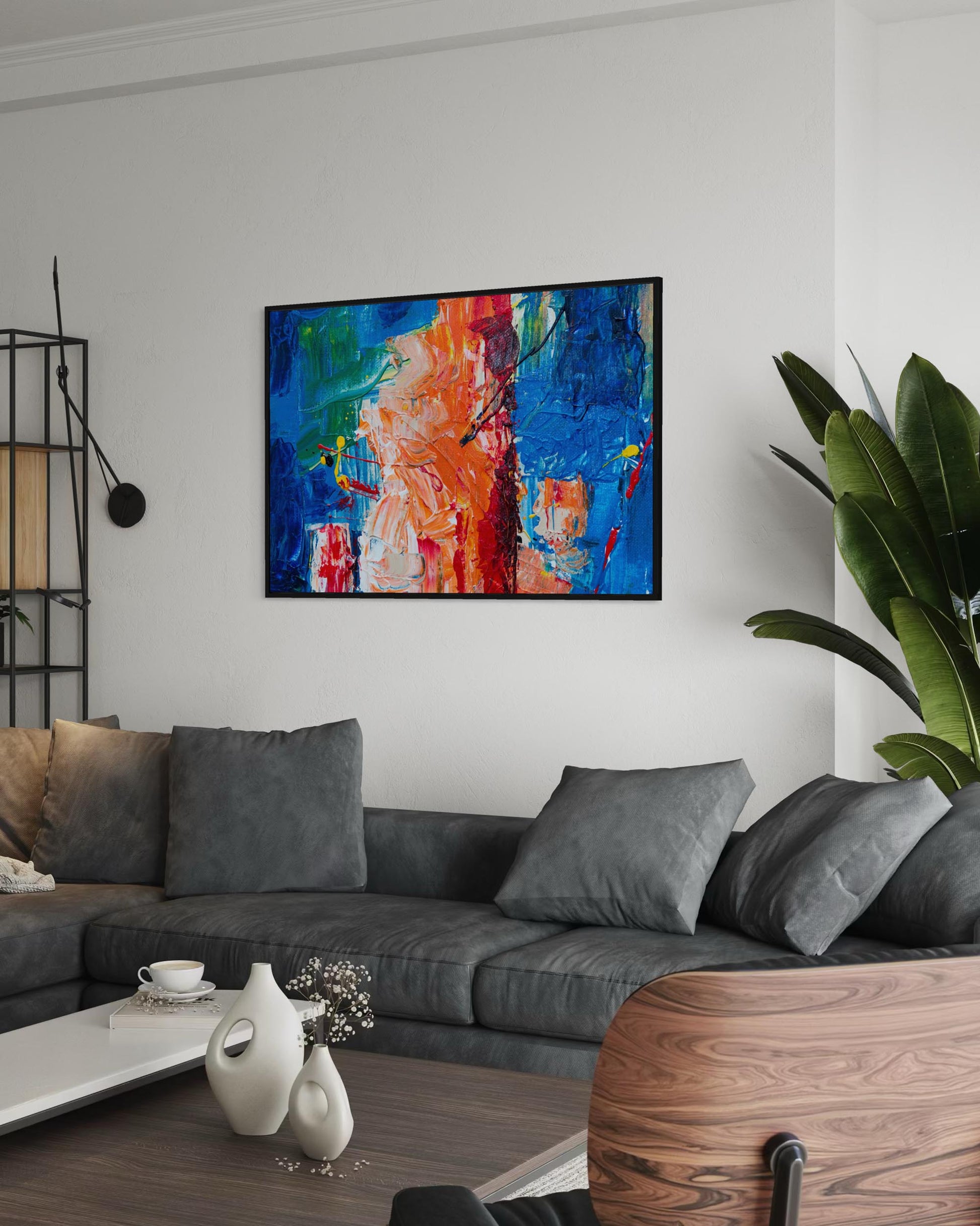 Modern living room with a gray sofa, decorative vases, and a colorful abstract painting on the wall.