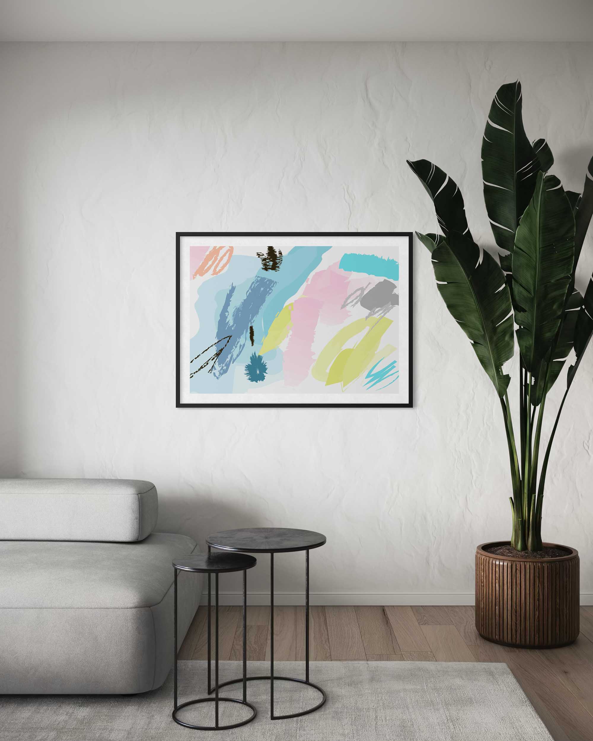 Abstract art print on a wall in a living room with a sofa and plant.