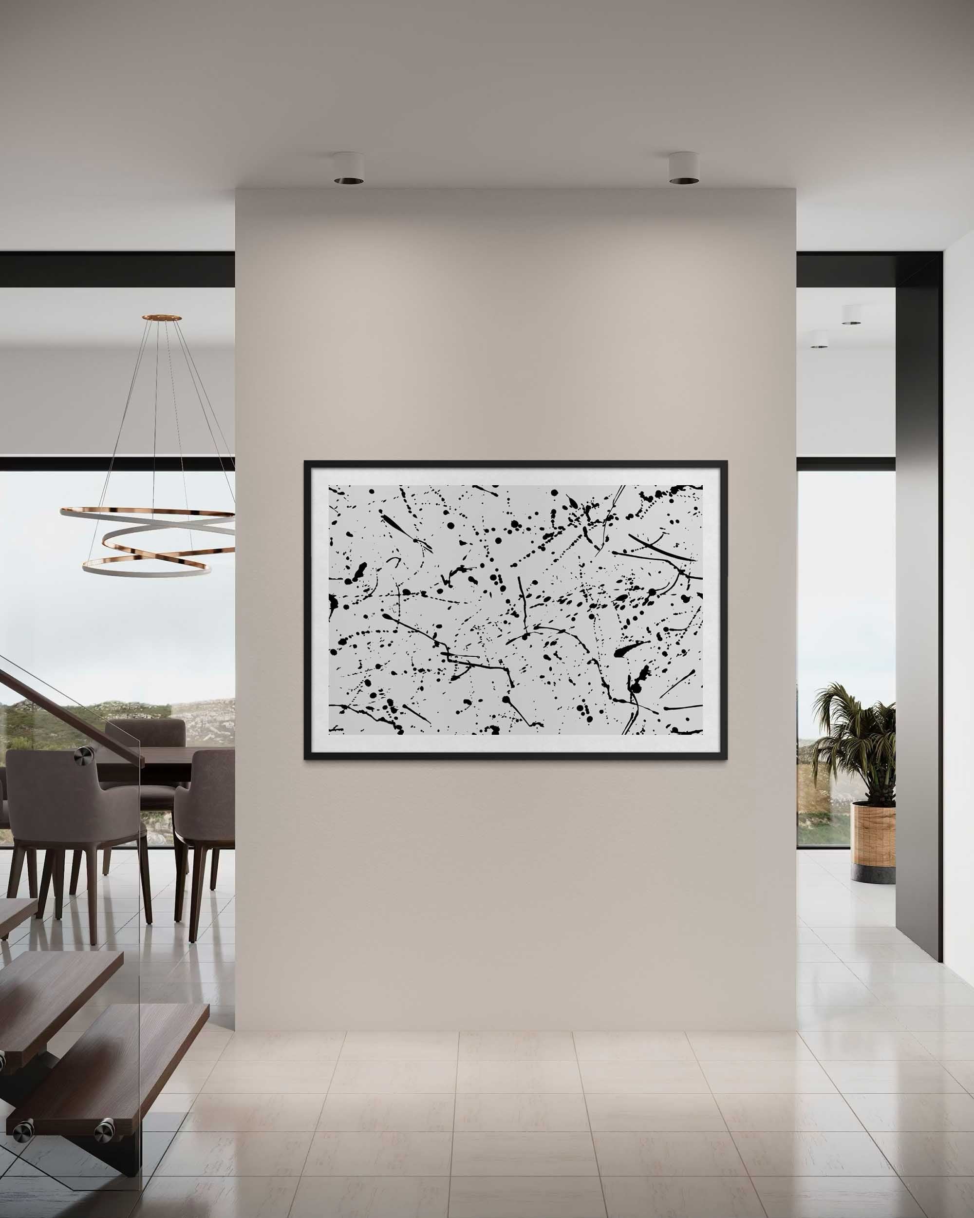 Abstract black and white painting on a wall in a modern interior setting