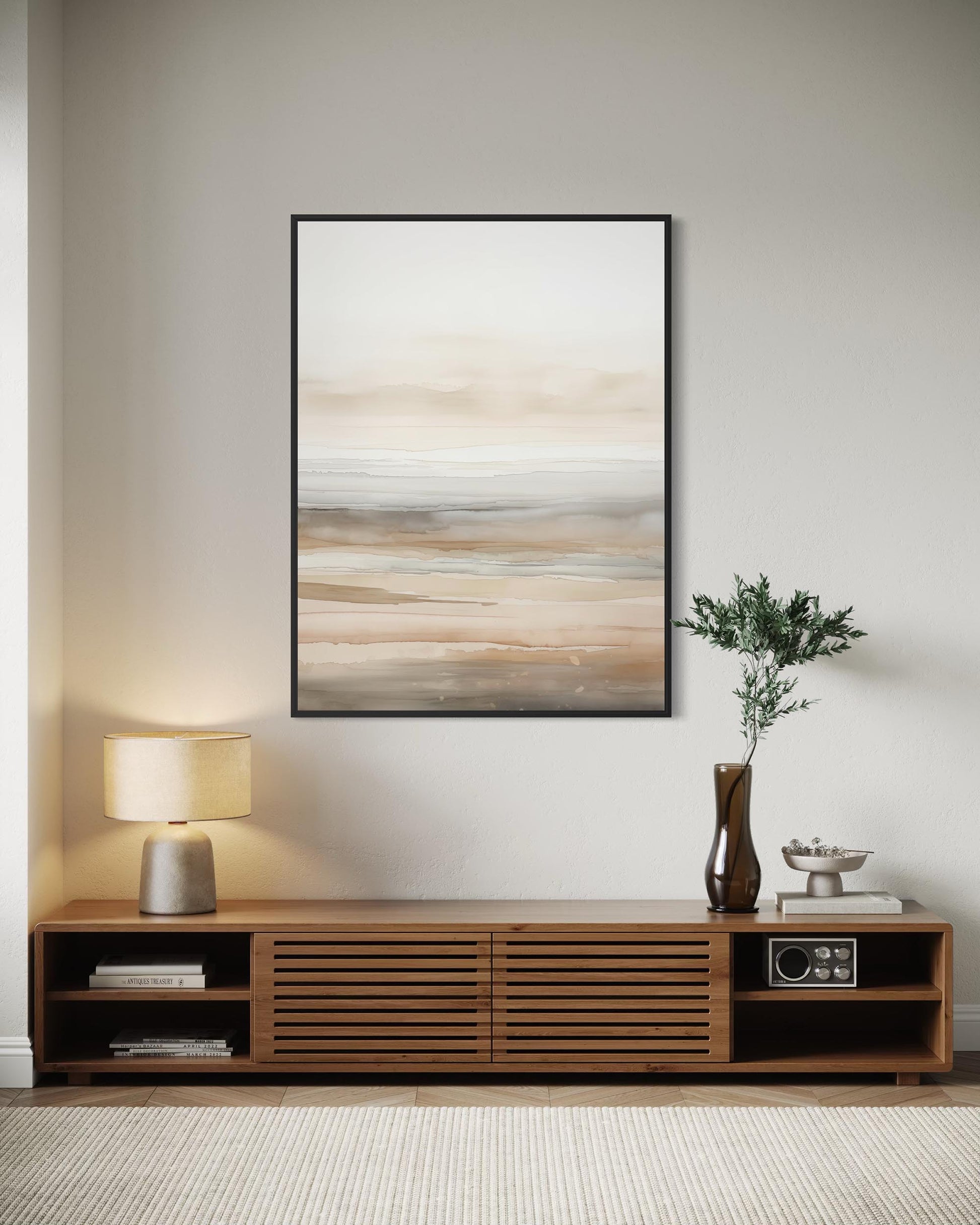 Modern living room with wooden console table, abstract painting, and decorative items.