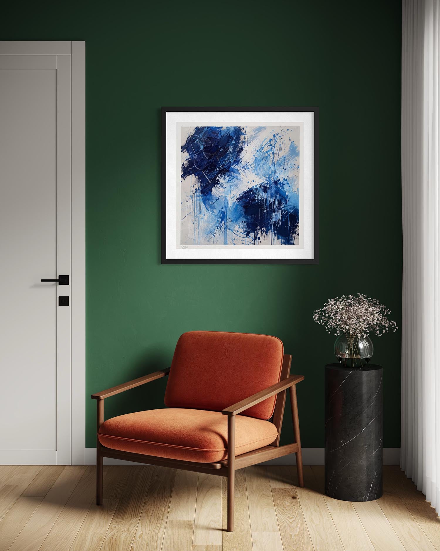 A framed abstract painting with blue and white brushstrokes hangs on a dark green wall above a rust-orange upholstered wooden armchair. A black marble side table with a glass vase of dried flowers stands to the right, next to a white door and light wood flooring.