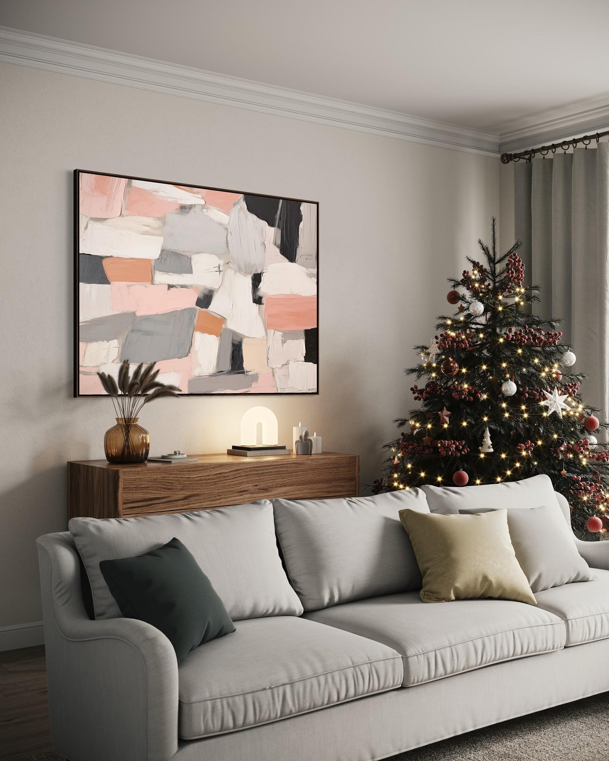 Living room with a Christmas tree, gray sofa, and abstract art on the wall.
