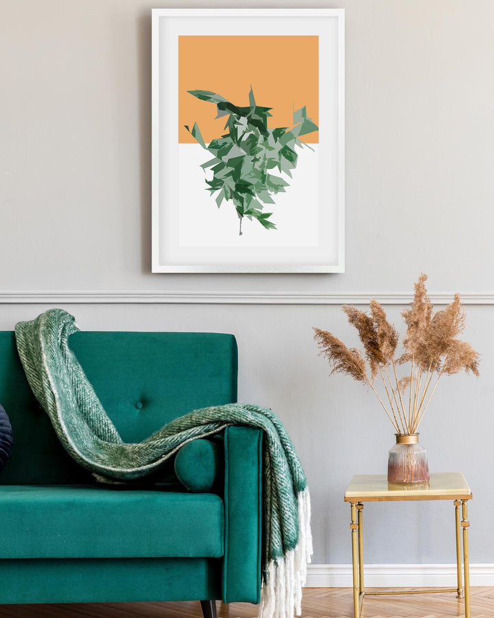 Teal sofa with a green blanket, framed plant art on the wall, and a small table with dried plants.