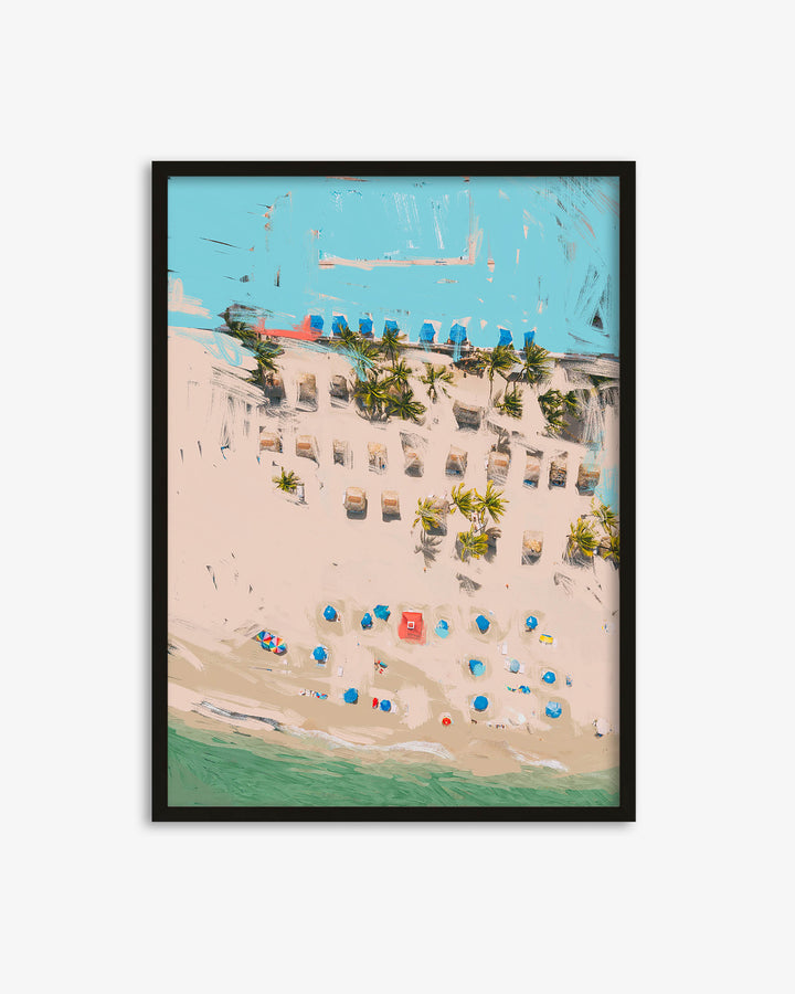 Framed artwork of a beach scene with lounge chairs and umbrellas.