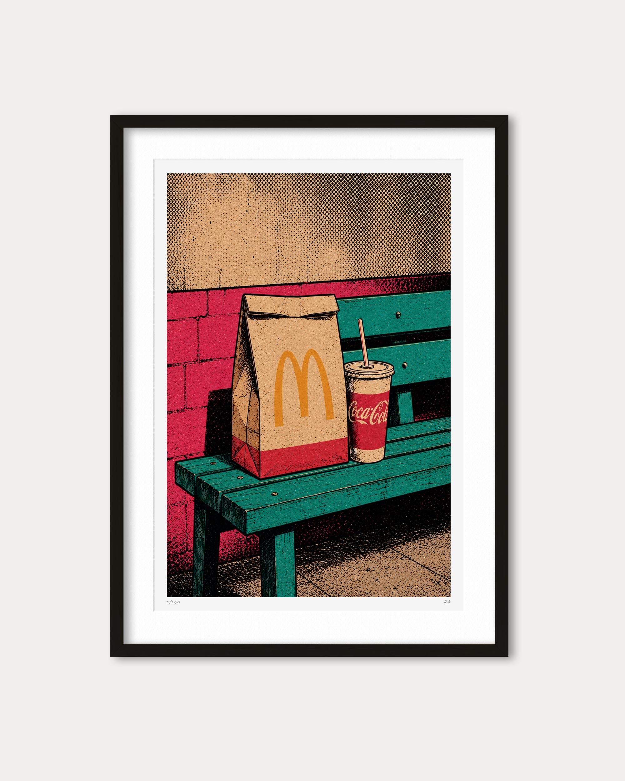 A framed pop-art style print featuring a McDonald's paper bag and a Coca-Cola cup on a teal bench against a pink brick wall, shown in a black frame with a white mat on a light gray background.