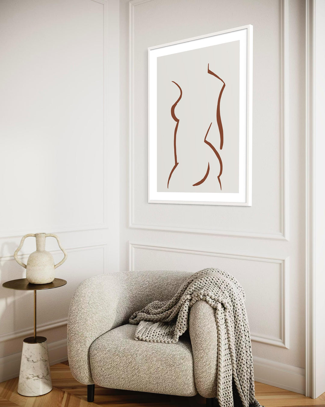 Modern interior with a chair, side table, and abstract art on the wall.
