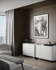 Modern living room with white cabinet, gray sofa, and framed artwork on wooden wall.
