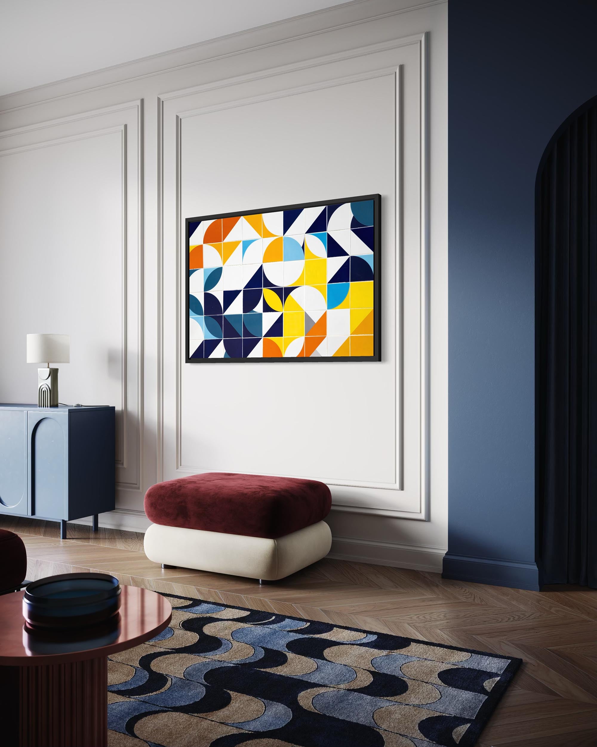 Modern living room with abstract art on the wall, colorful rug, and furniture.