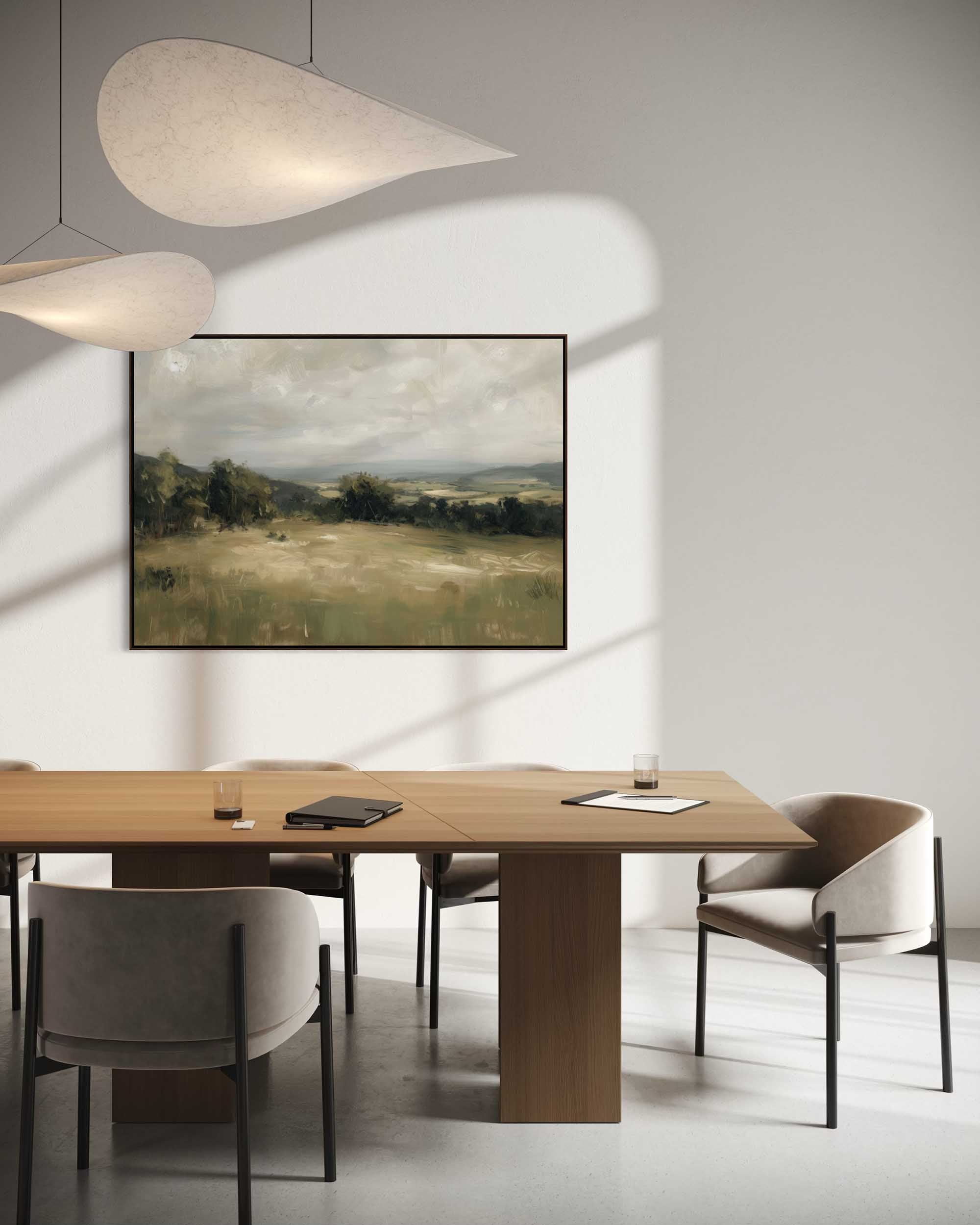 Modern dining room with wooden table, chairs, and a landscape painting on the wall.