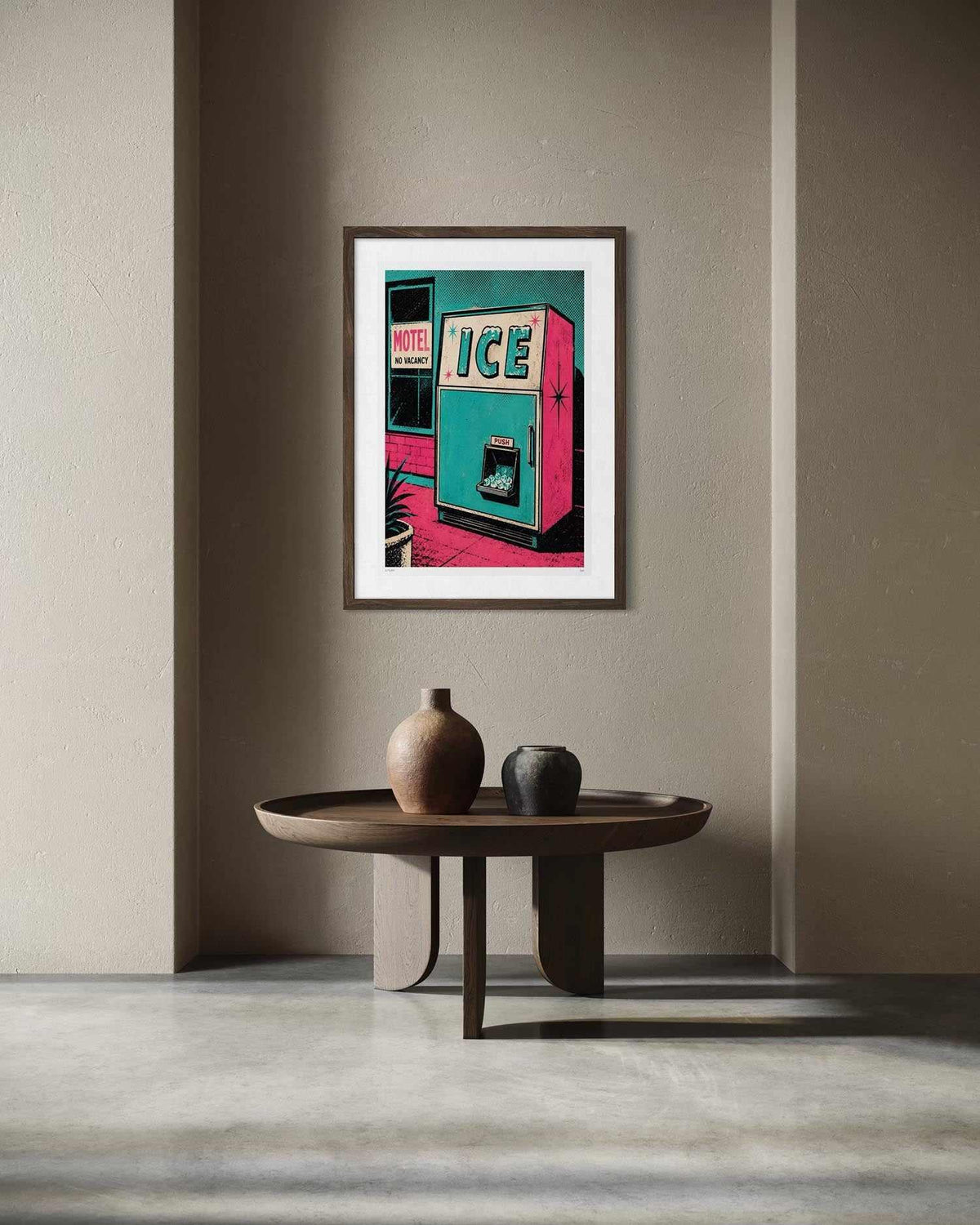 A framed pop-art print of a retro vending machine hanging on a beige wall above a round wooden coffee table with decorative vases.