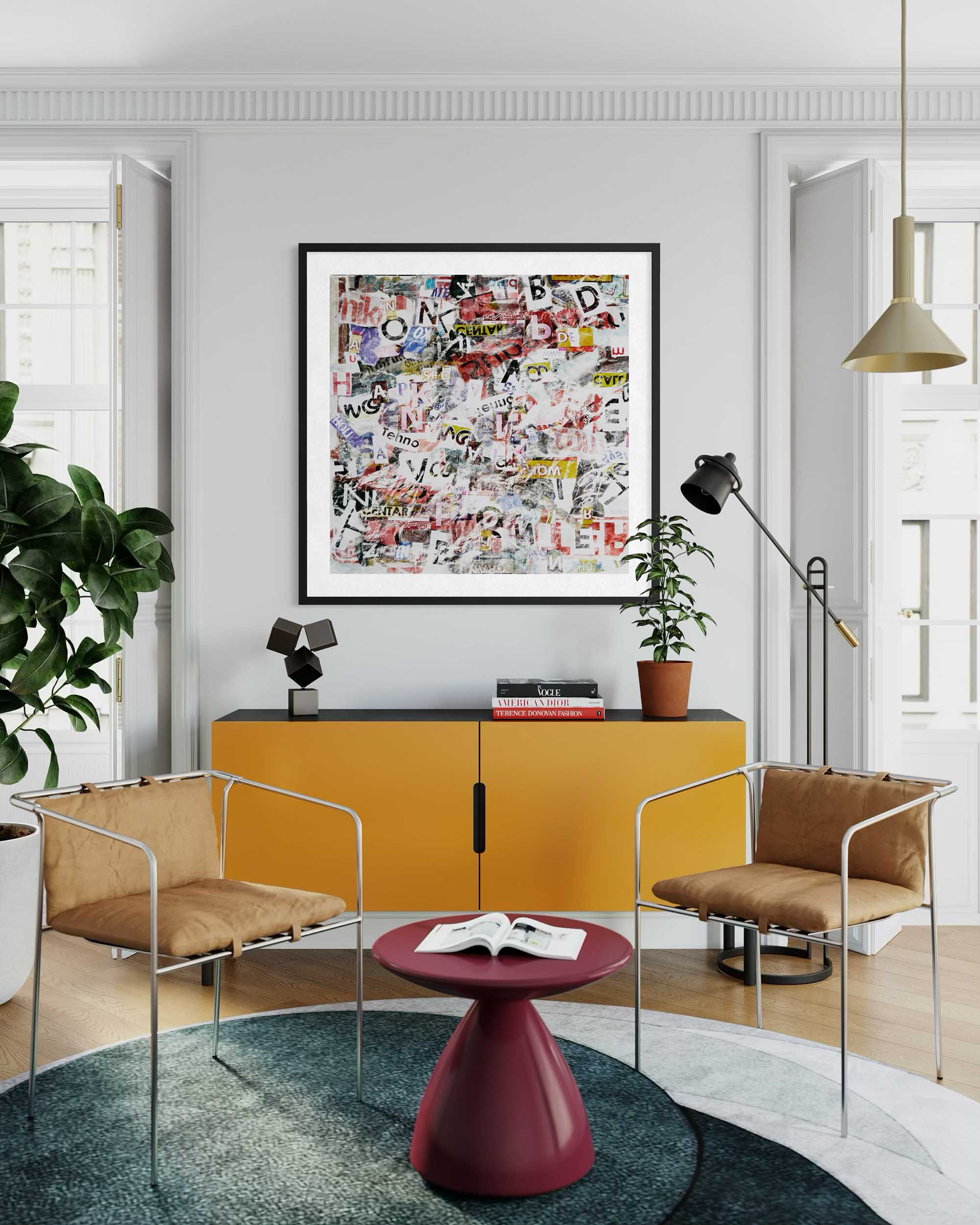 Modern living room with yellow cabinet, brown chairs, and colorful abstract art on the wall.