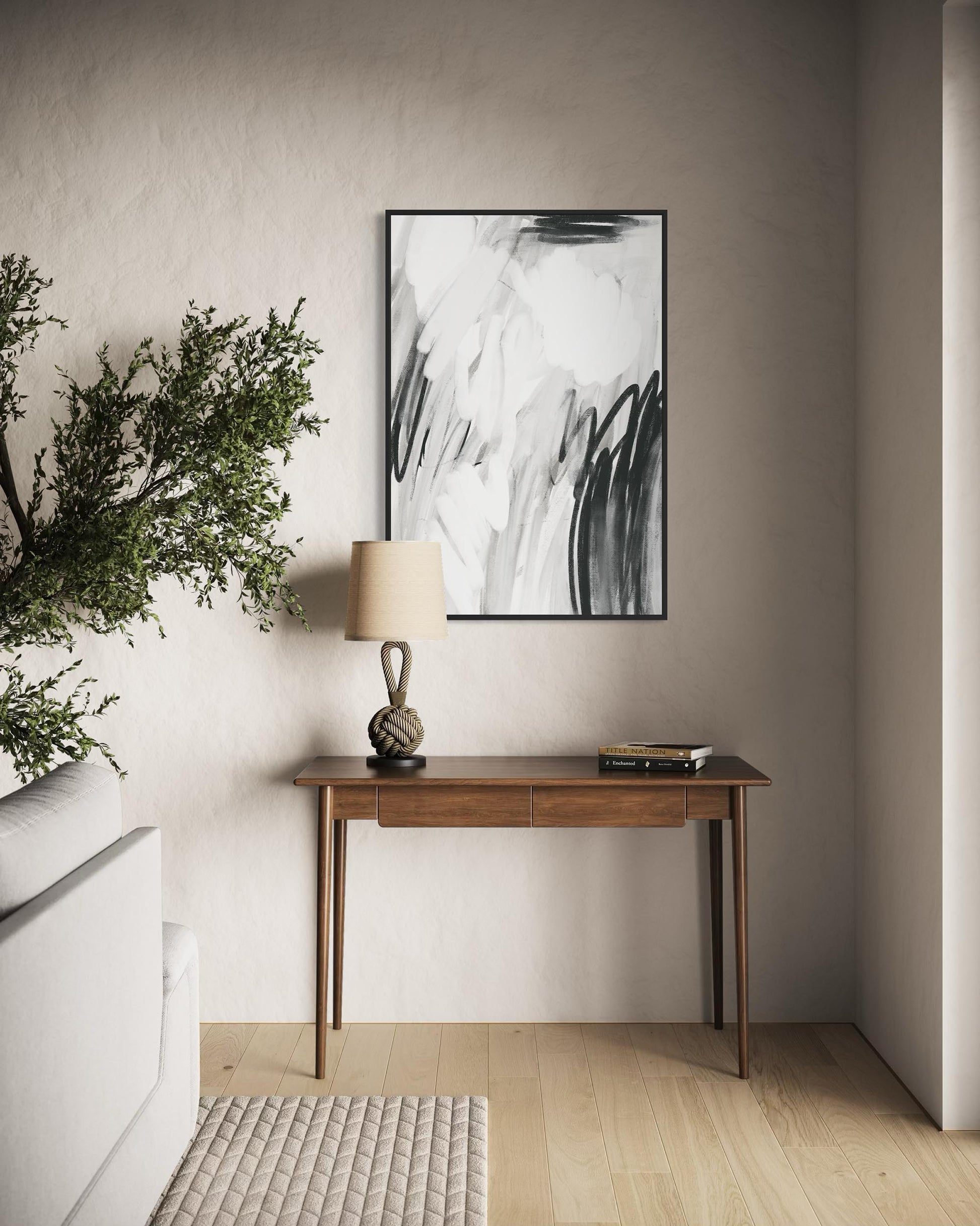 Modern interior with a wooden console table, abstract art, and decorative items.