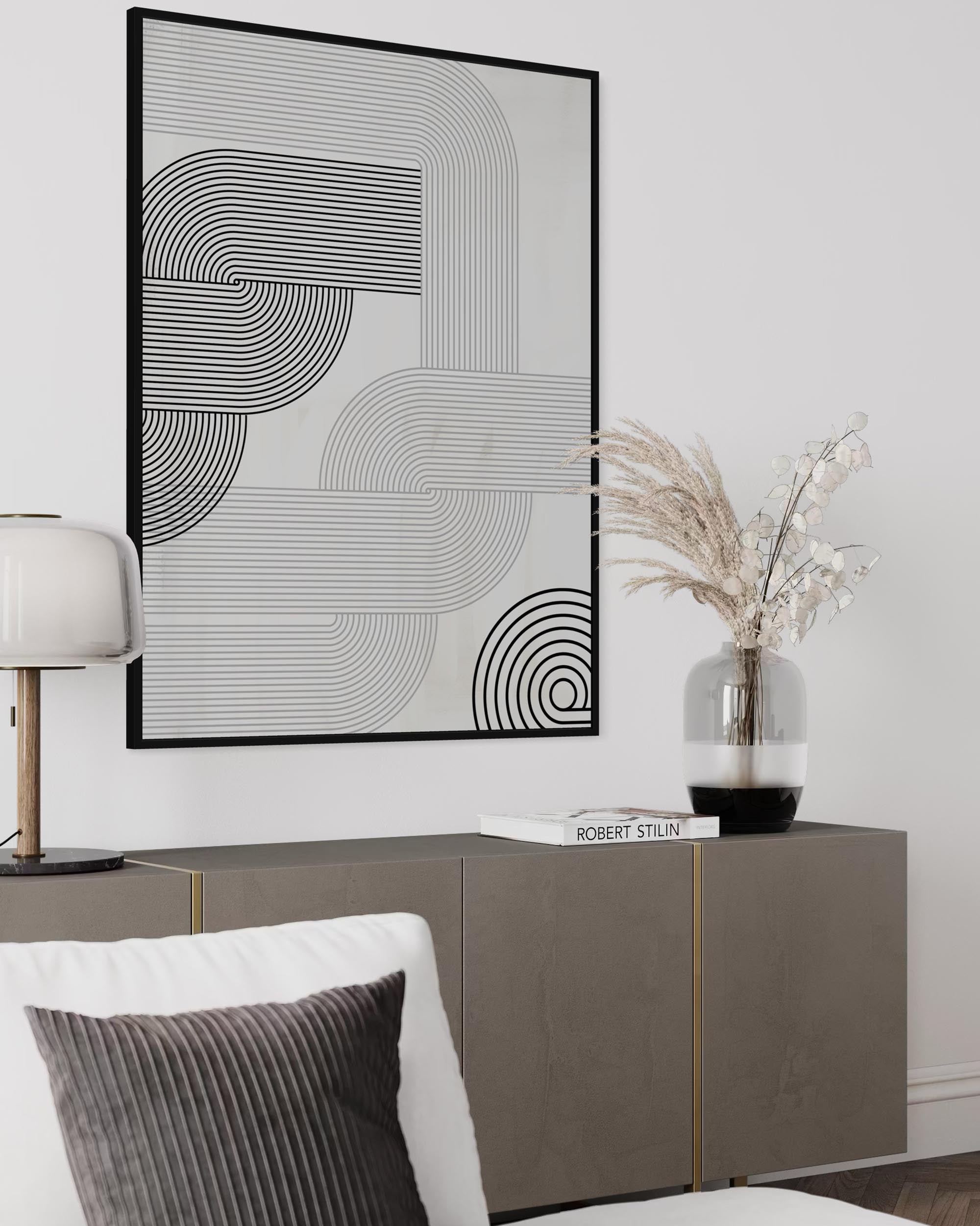 Modern interior with abstract wall art, sideboard, and decorative elements.