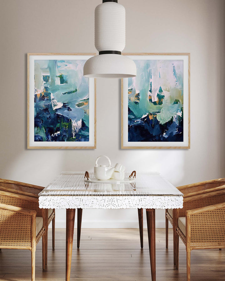 Dining room with abstract art on the wall, a glass table, and wooden chairs.