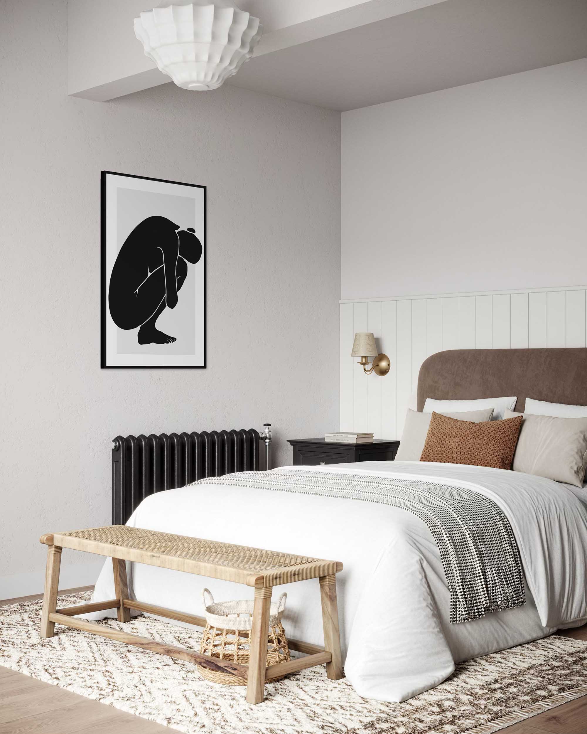 Modern bedroom with a bed, bench, and wall art