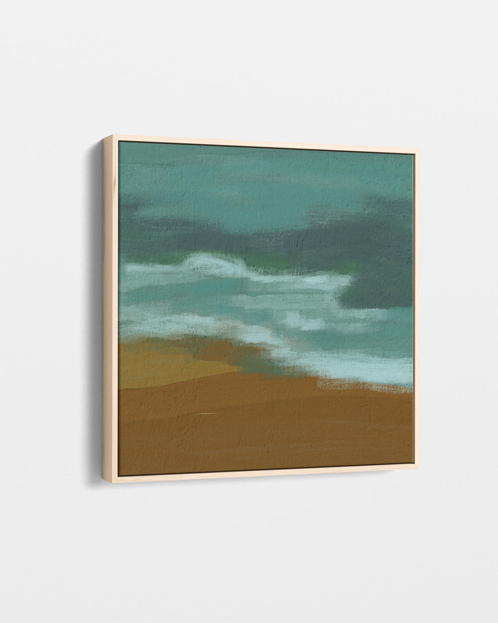 Framed artwork of a beach scene with waves and sand on a white background