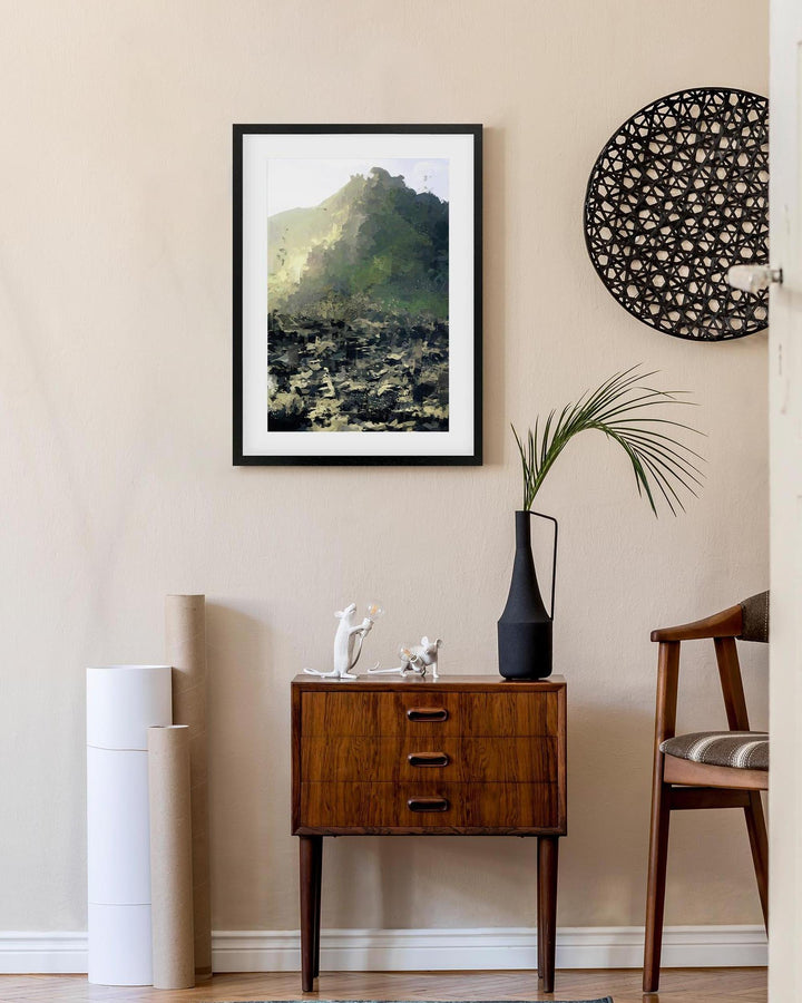 Modern interior with a wooden side table, framed artwork, and decorative items.