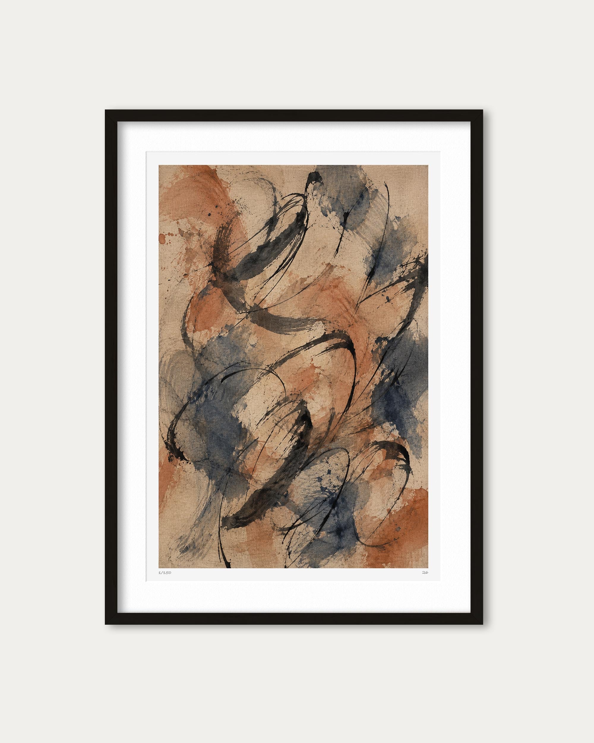 A framed abstract art print featuring expressive black ink-like scribbles over a warm beige and terracotta background, presented in a black frame with a white mat against a light gray wall.