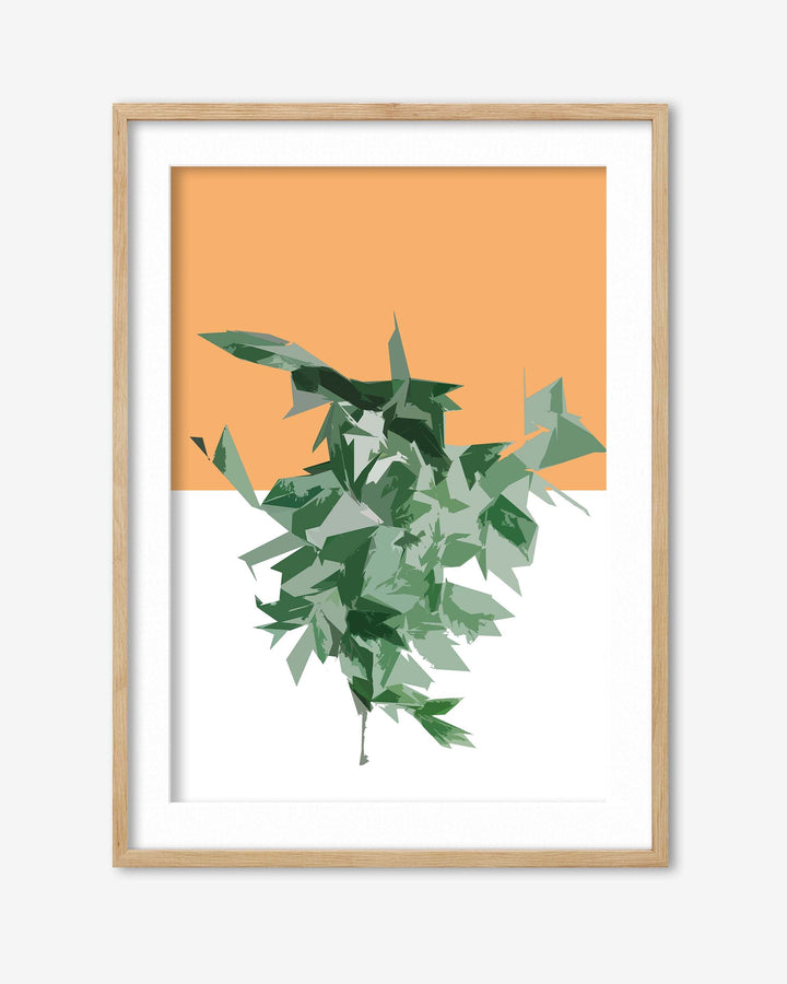 Framed artwork with green leaves on an orange background