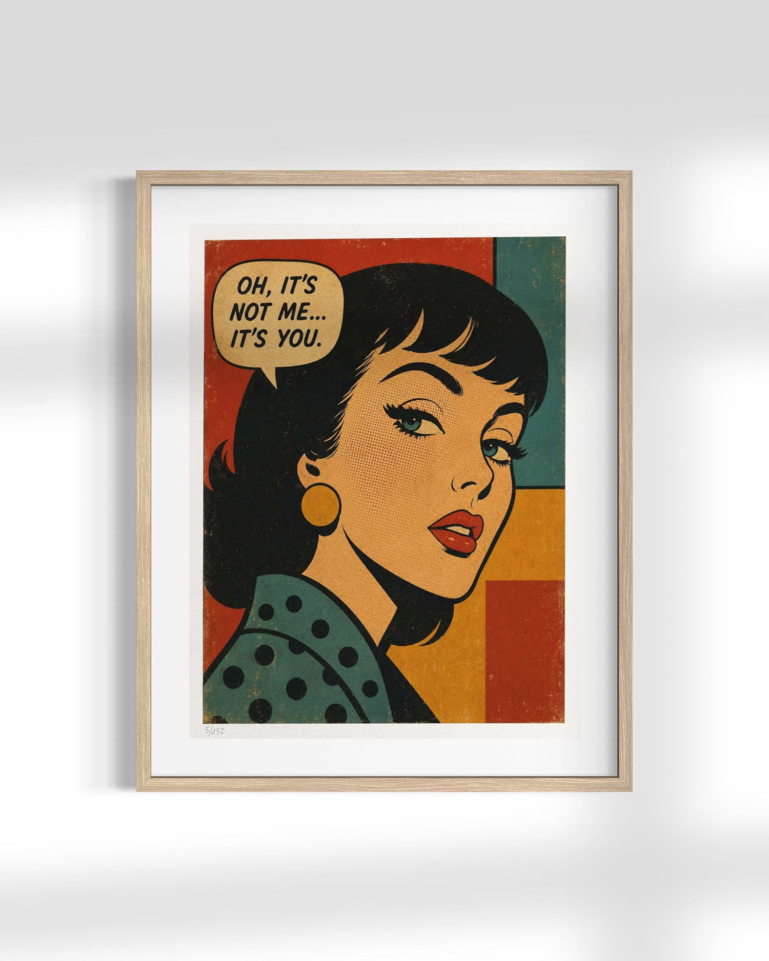 A framed pop-art style print featuring a woman's portrait with a speech bubble that reads, 'OH, IT'S NOT ME.