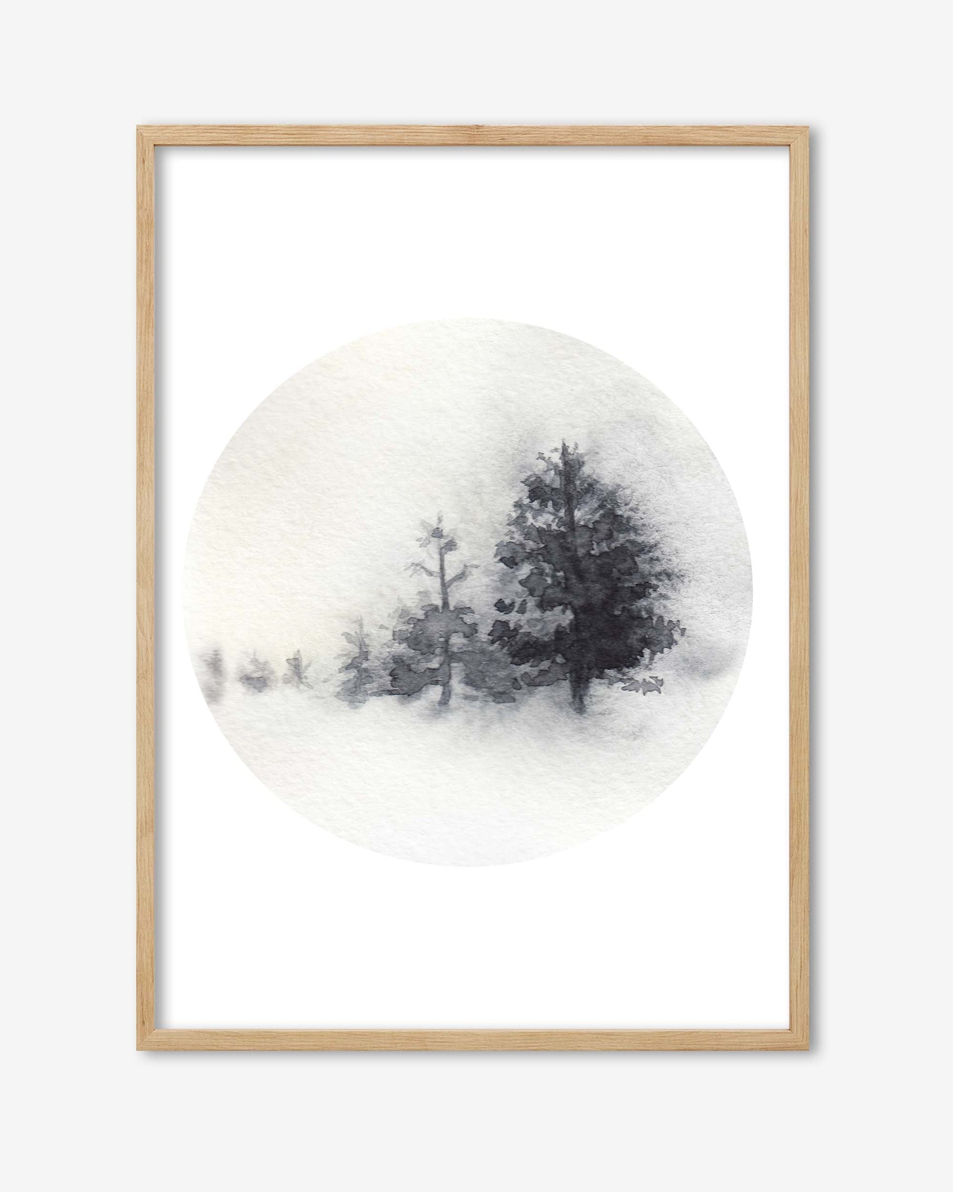 Framed artwork of trees on a snowy background