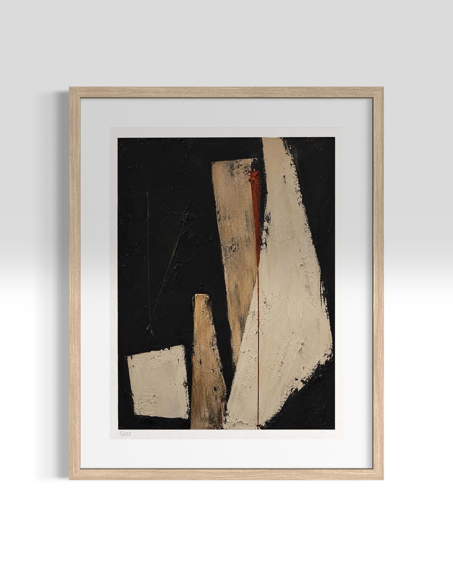A framed abstract art print featuring geometric shapes in beige, brown, and white against a black background, enclosed in a light wood frame with a white mat, shown against a neutral gray wall.