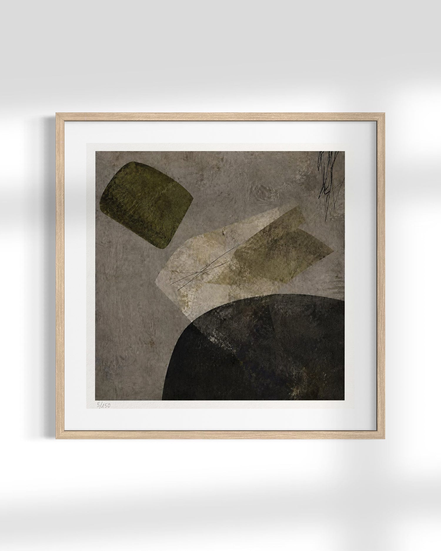 A framed abstract art print featuring textured geometric shapes in olive green, beige, and black on a gray background, housed in a light natural wood frame with a white mat.