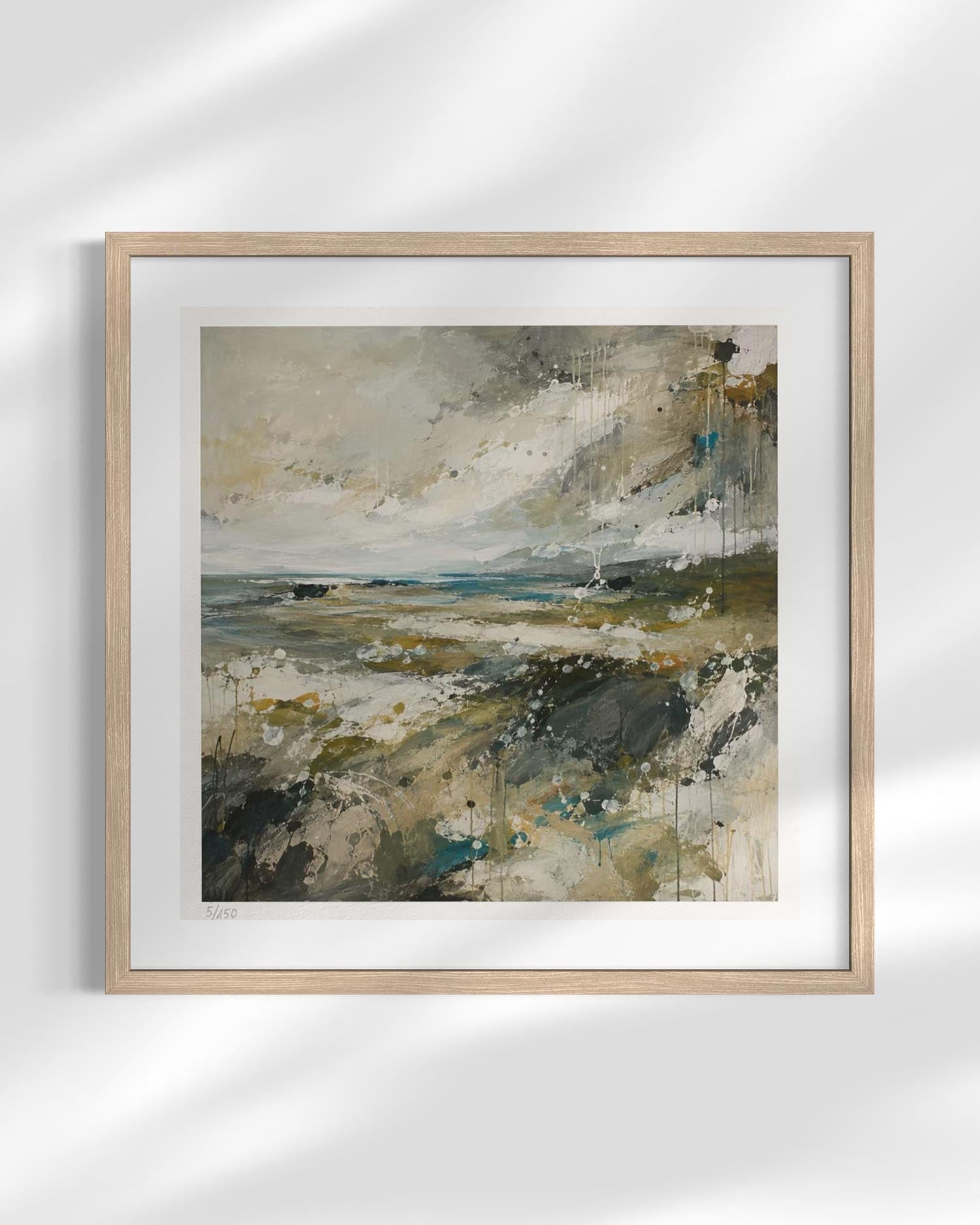 Framed abstract landscape painting with a light wood frame and white mat, displayed on a white wall with soft diagonal shadows.