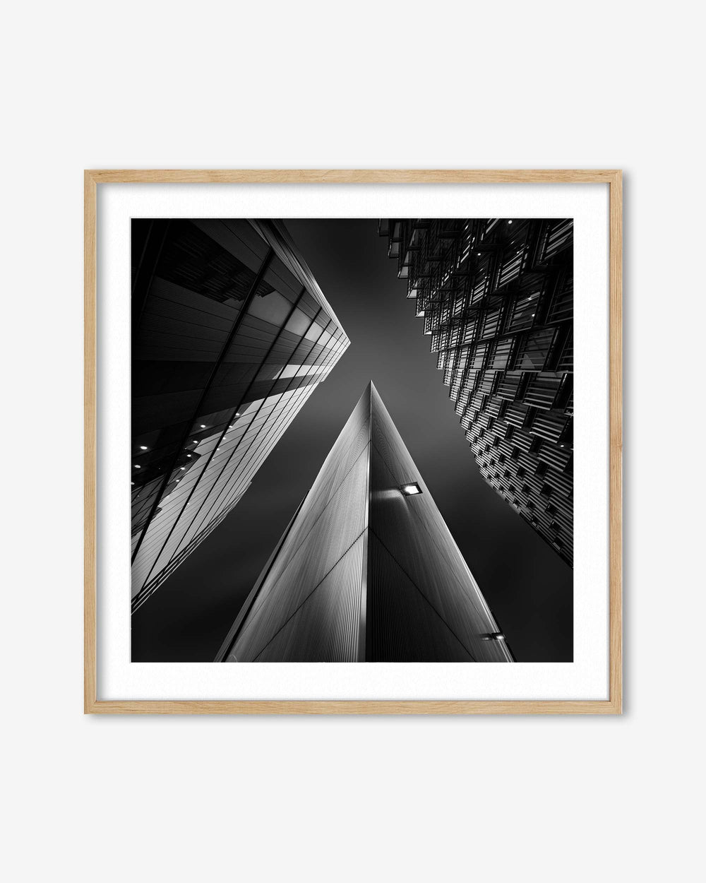 Framed black and white architectural photograph of a building corner.