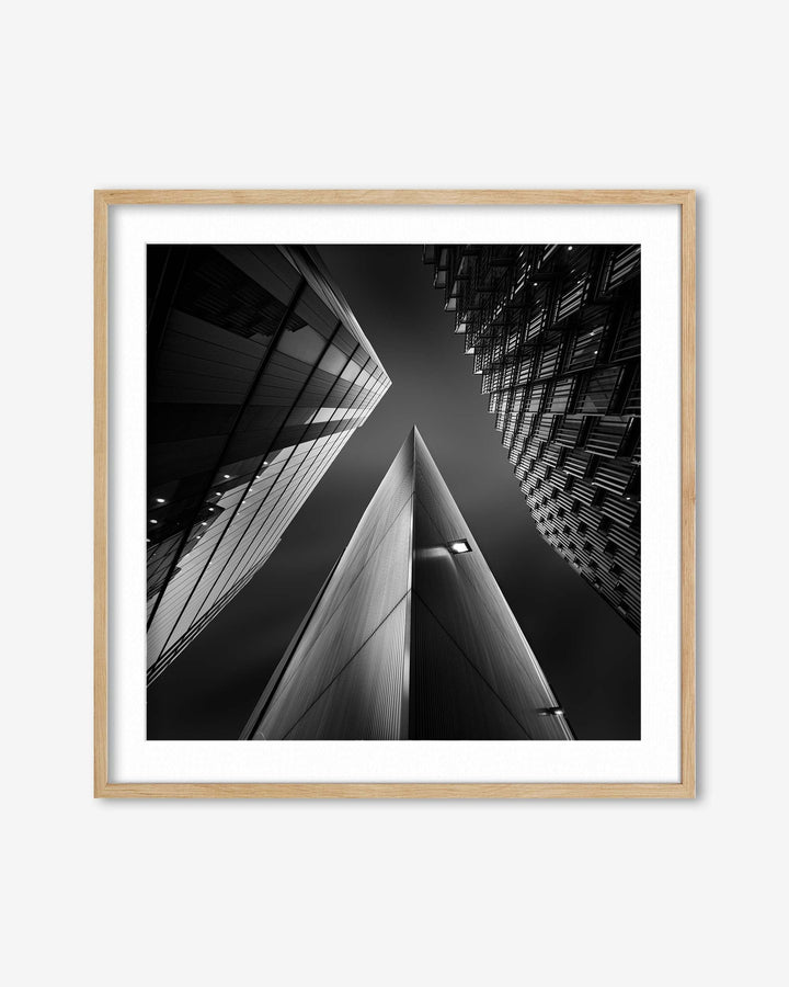 Framed black and white architectural photograph of a building corner.