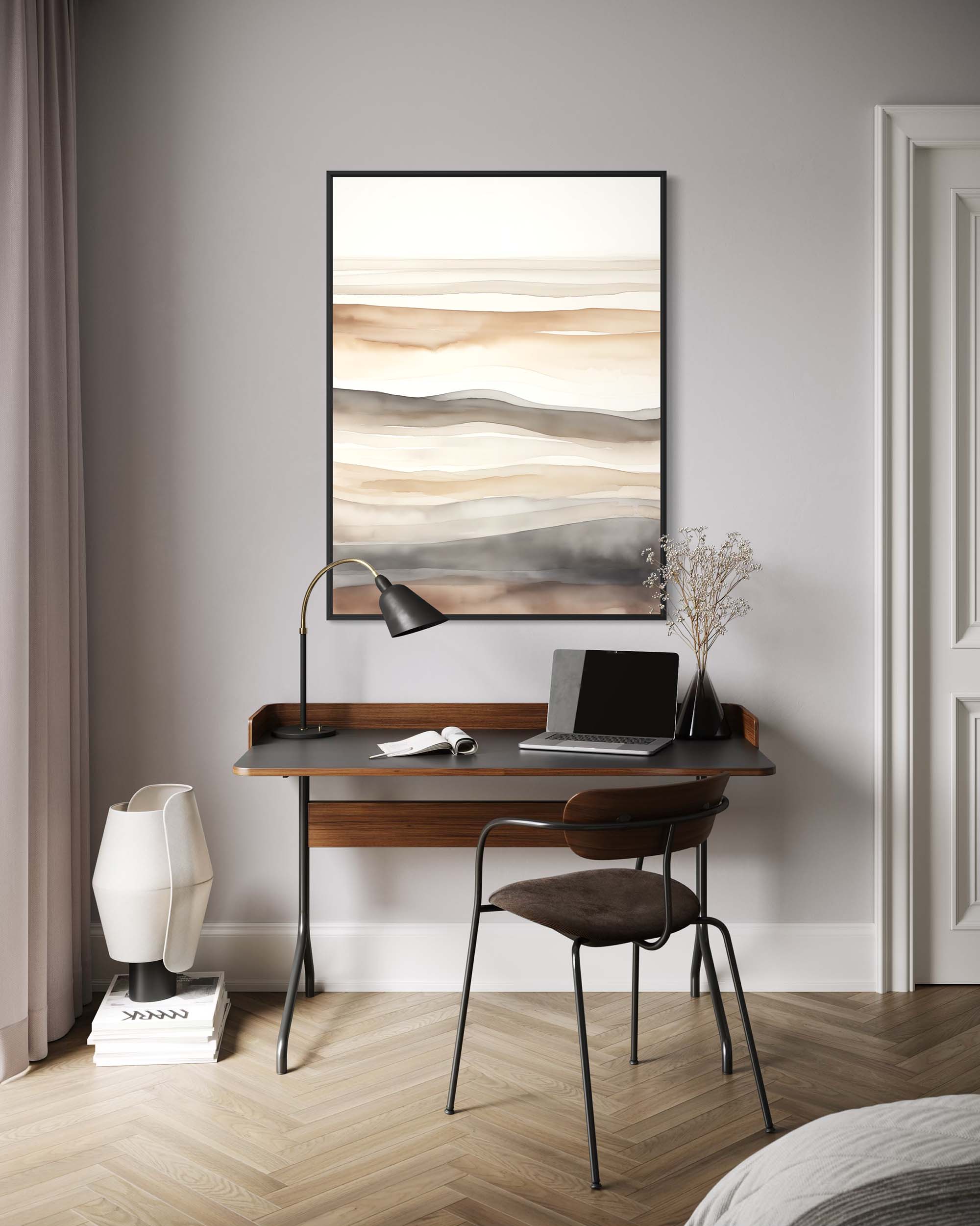 Modern home office with wooden desk, chair, lamp, and abstract art on gray wall.