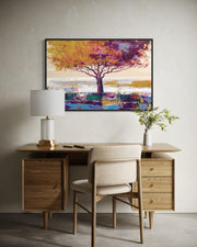 Wooden desk with chair, lamp, and decorative painting in a room.