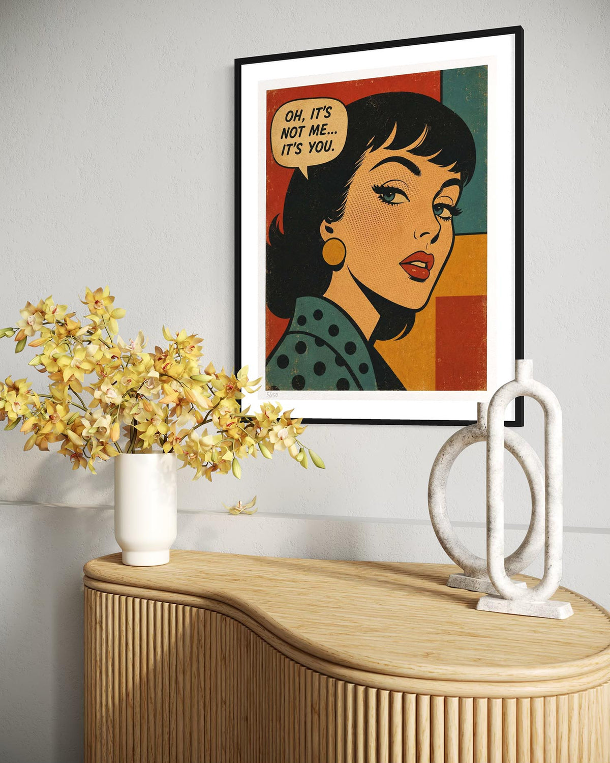 A framed pop-art print featuring a retro woman with a speech bubble reading 'OH, IT'S NOT ME.
