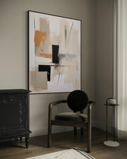 Modern interior with abstract art, chair, and side table.
