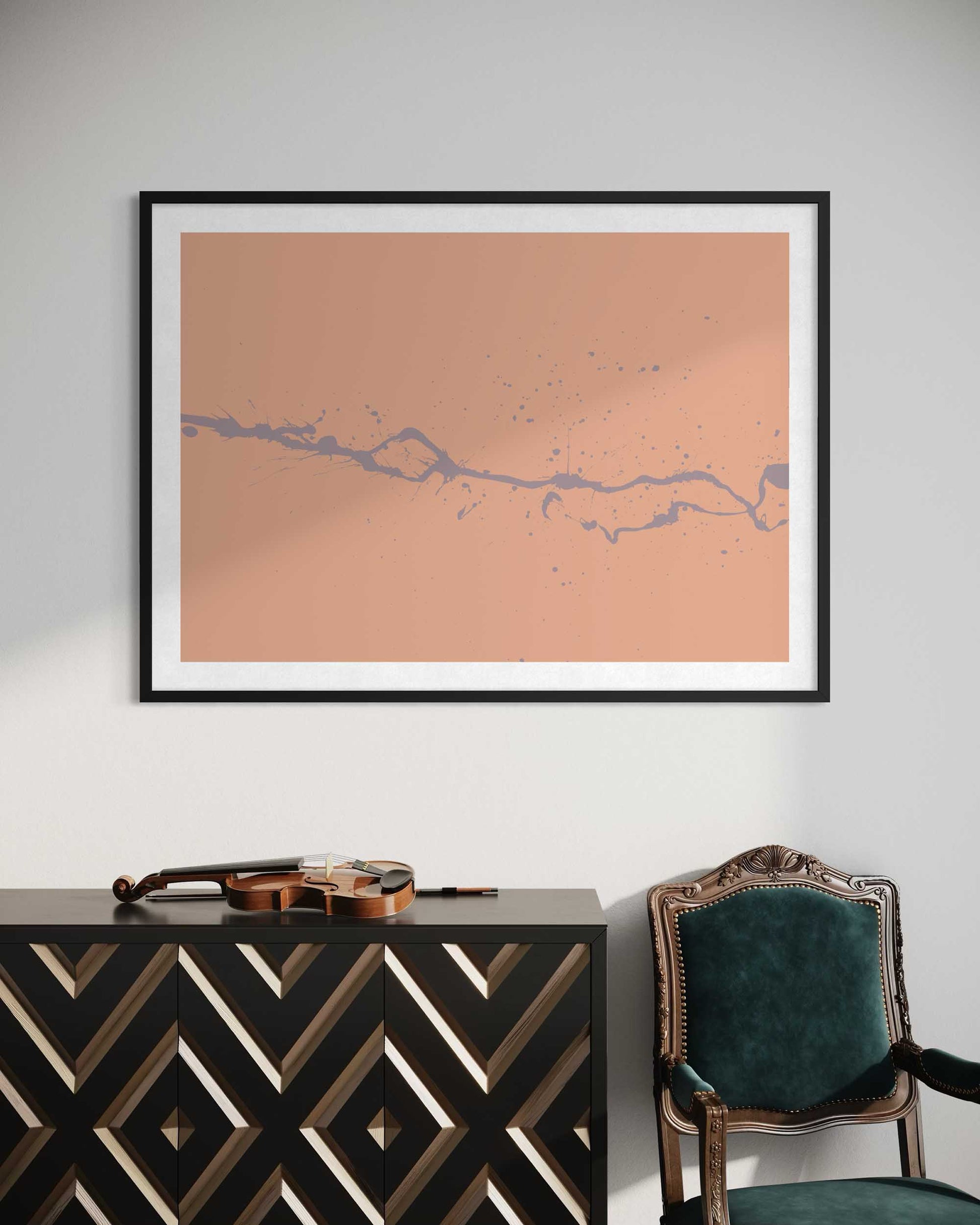 Framed abstract art on a wall above a console table with a chair.
