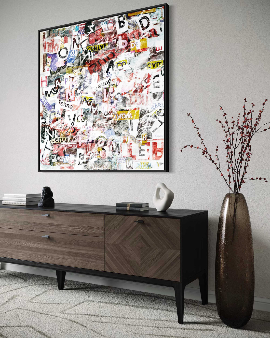 Modern living room with a wooden console table, decorative vase, and framed collage art.