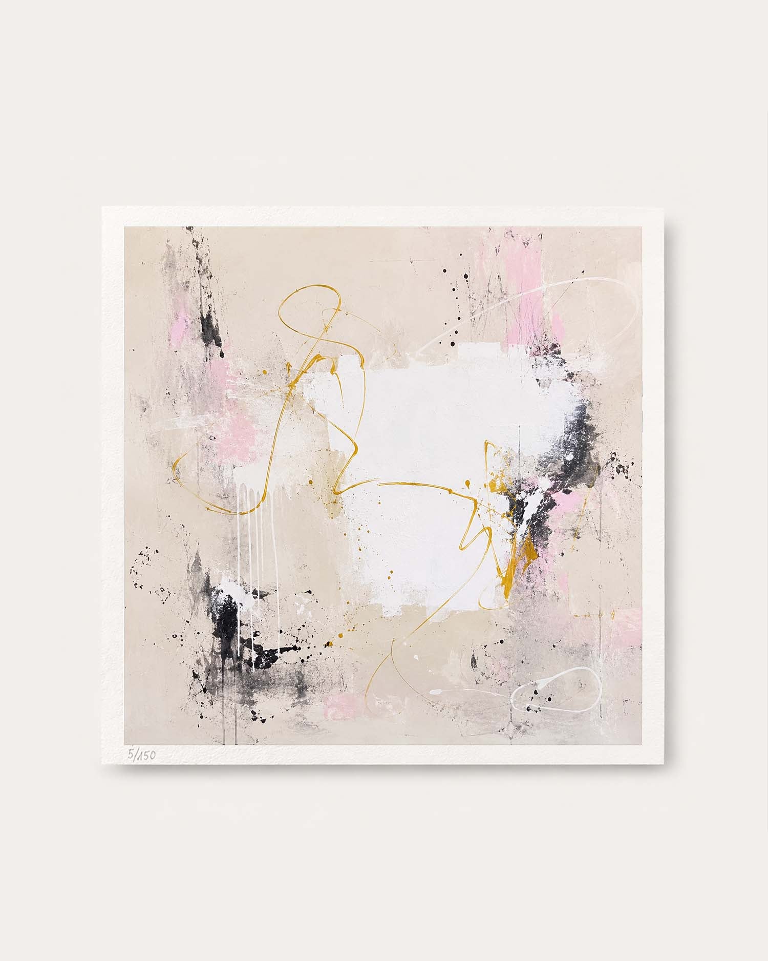 An abstract square wall art print with a white border, featuring a beige background with white, black, and pink brushstrokes, delicate gold line details, and a signature in the lower left corner.