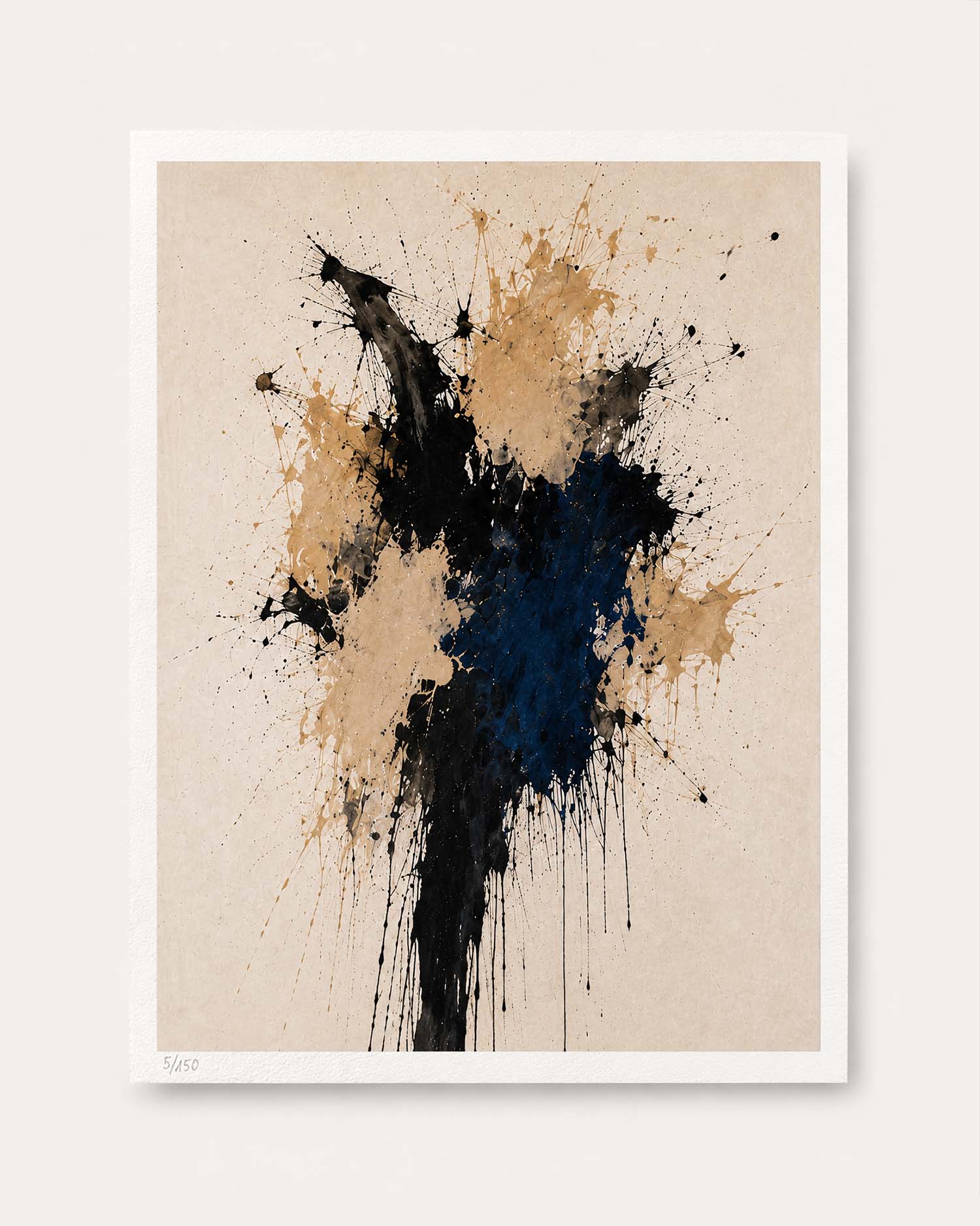 An abstract art print featuring a paint splatter design in black, navy blue, and tan on a textured beige background, presented with a white border against a light gray wall.