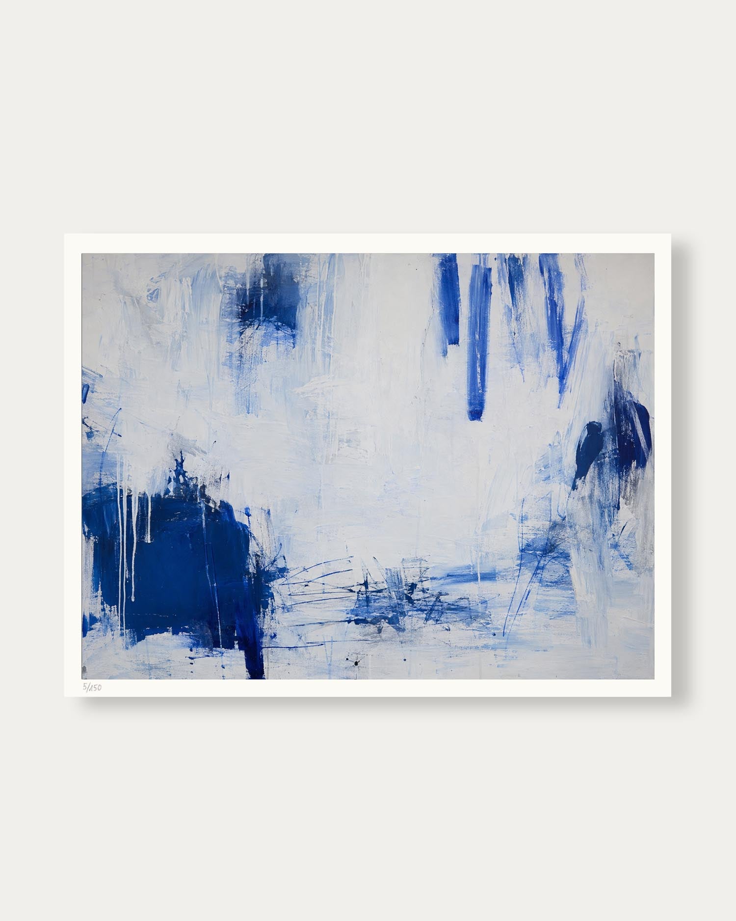 An abstract canvas painting featuring textured blue and navy brushstrokes on a white background, framed with a clean white border and displayed against a neutral light gray wall.