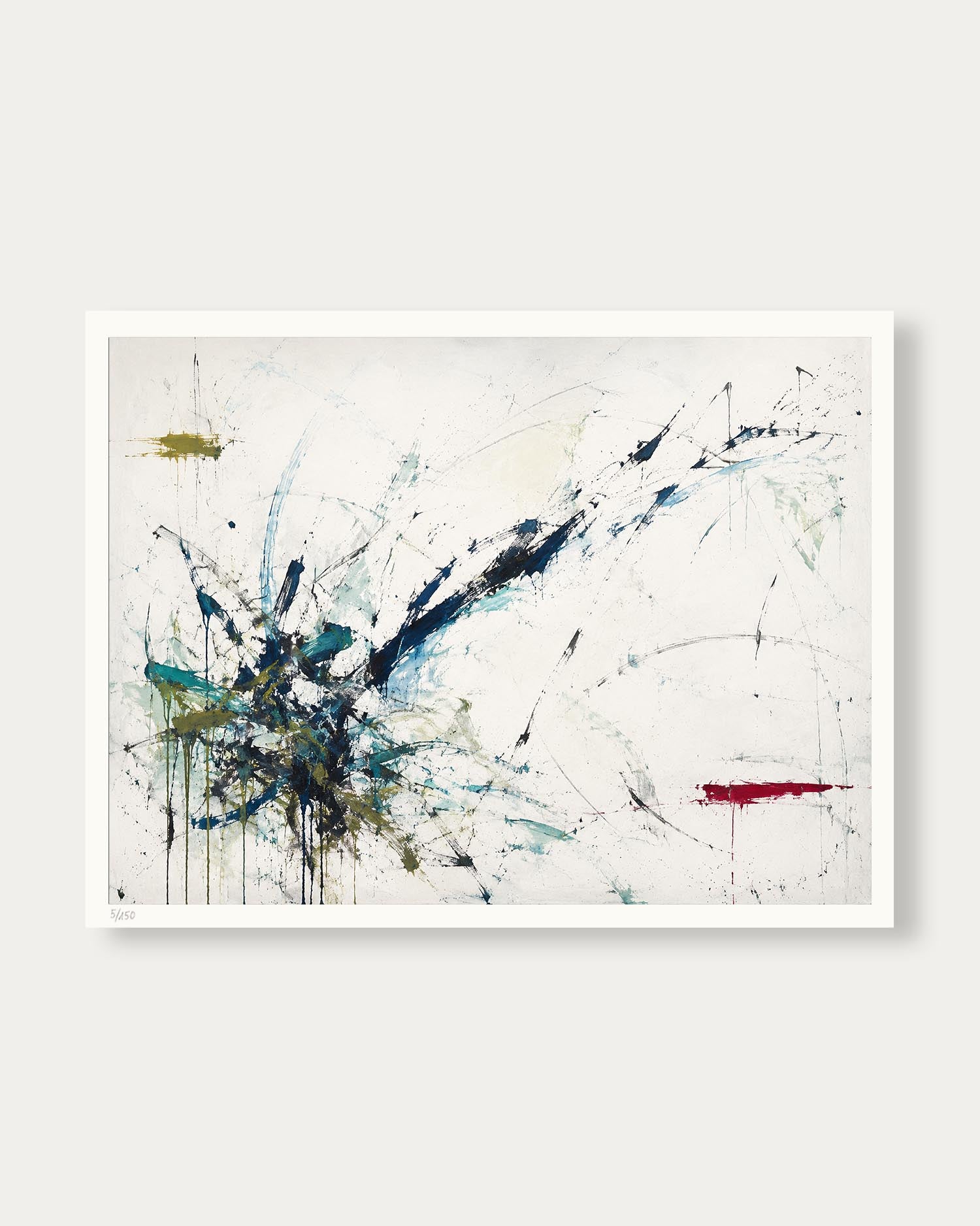 An abstract art print featuring expressive splatters and drips in blue, black, red, and green on a textured off-white background, presented with a clean white border against a light gray wall.