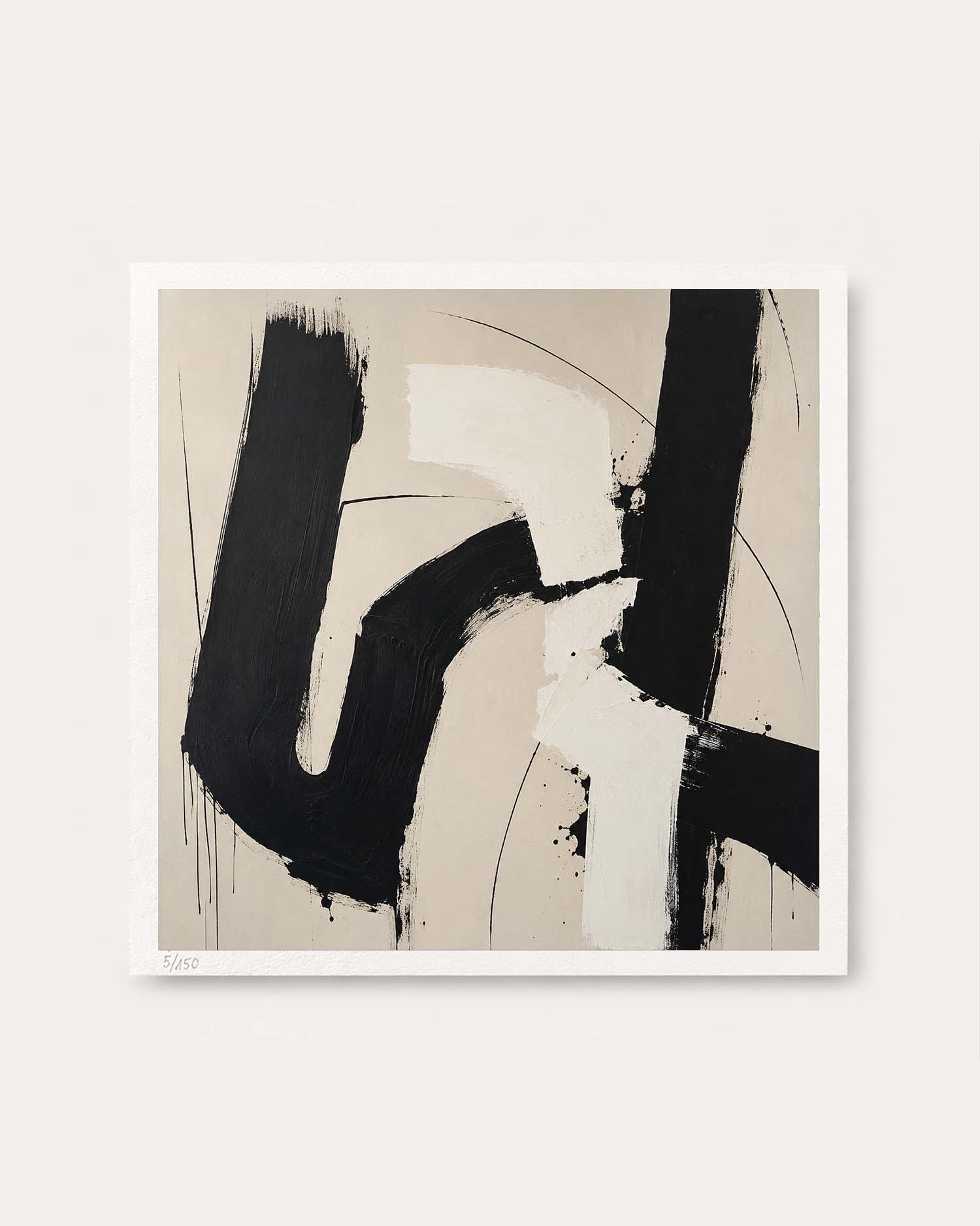An abstract art print featuring bold black and off-white brushstrokes on a warm beige background, presented with a white border against a light gray wall.