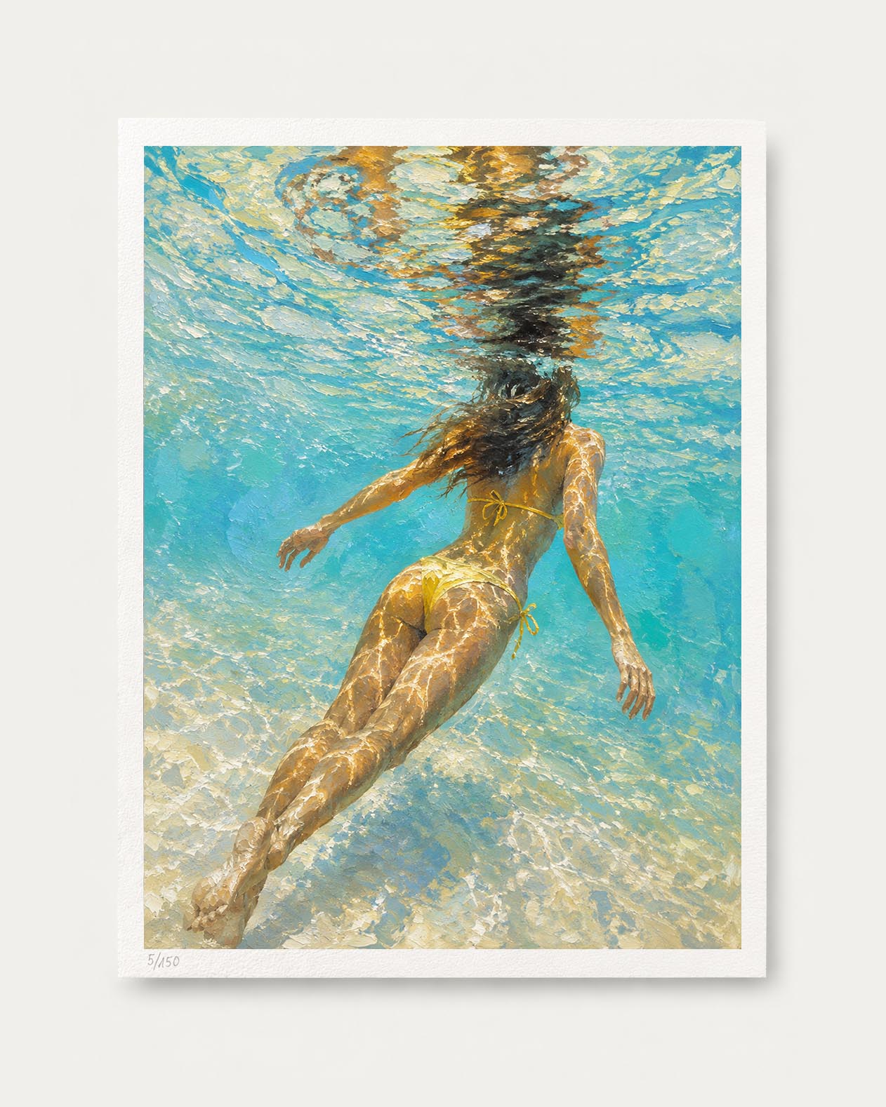 An art print featuring an underwater photograph of a woman swimming, with turquoise water, sunbeams, and sandy seabed details, presented with a white border on a light gray background.