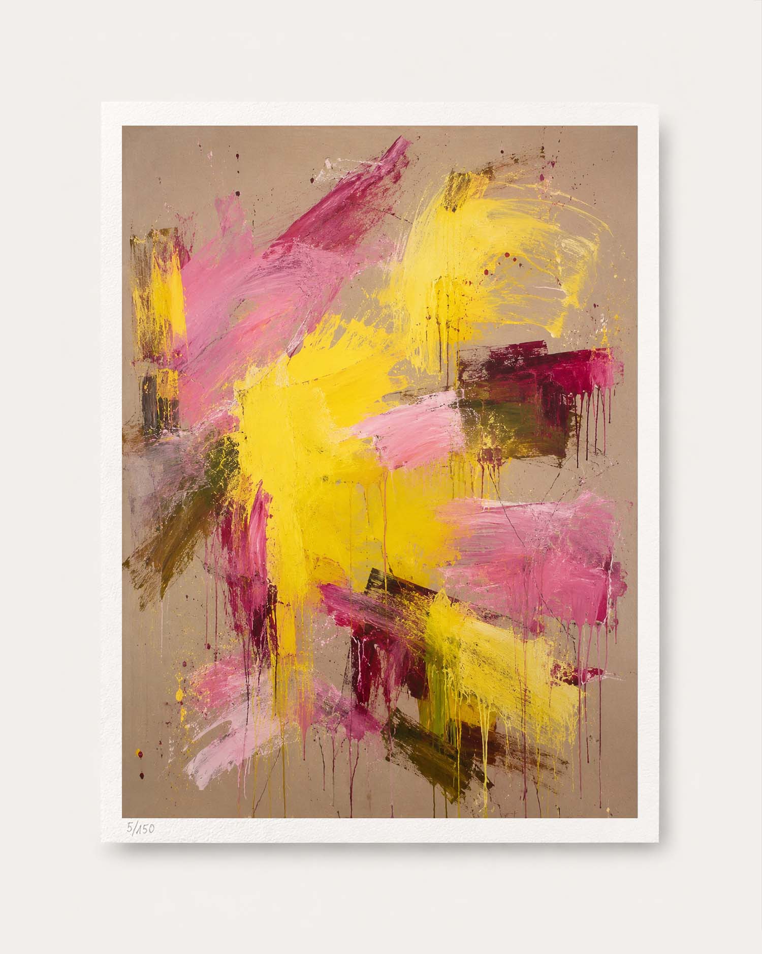 An abstract art print featuring bold yellow and magenta paint strokes on a textured beige background, presented with a white border against a light gray wall.