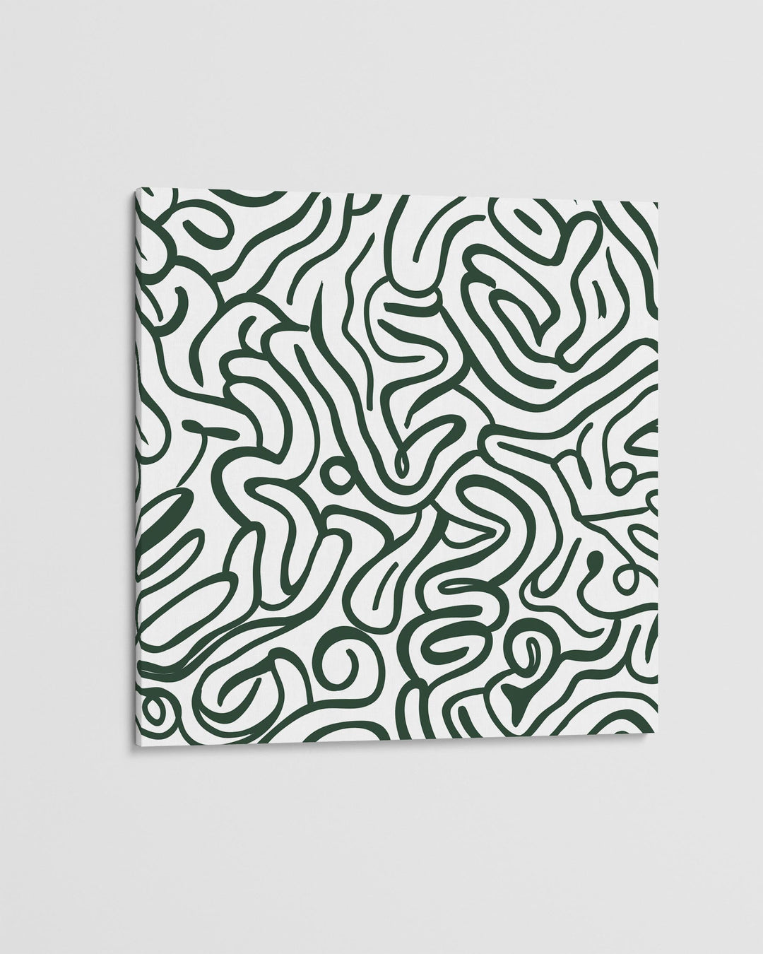 Patterned fabric with green abstract design on a light gray background