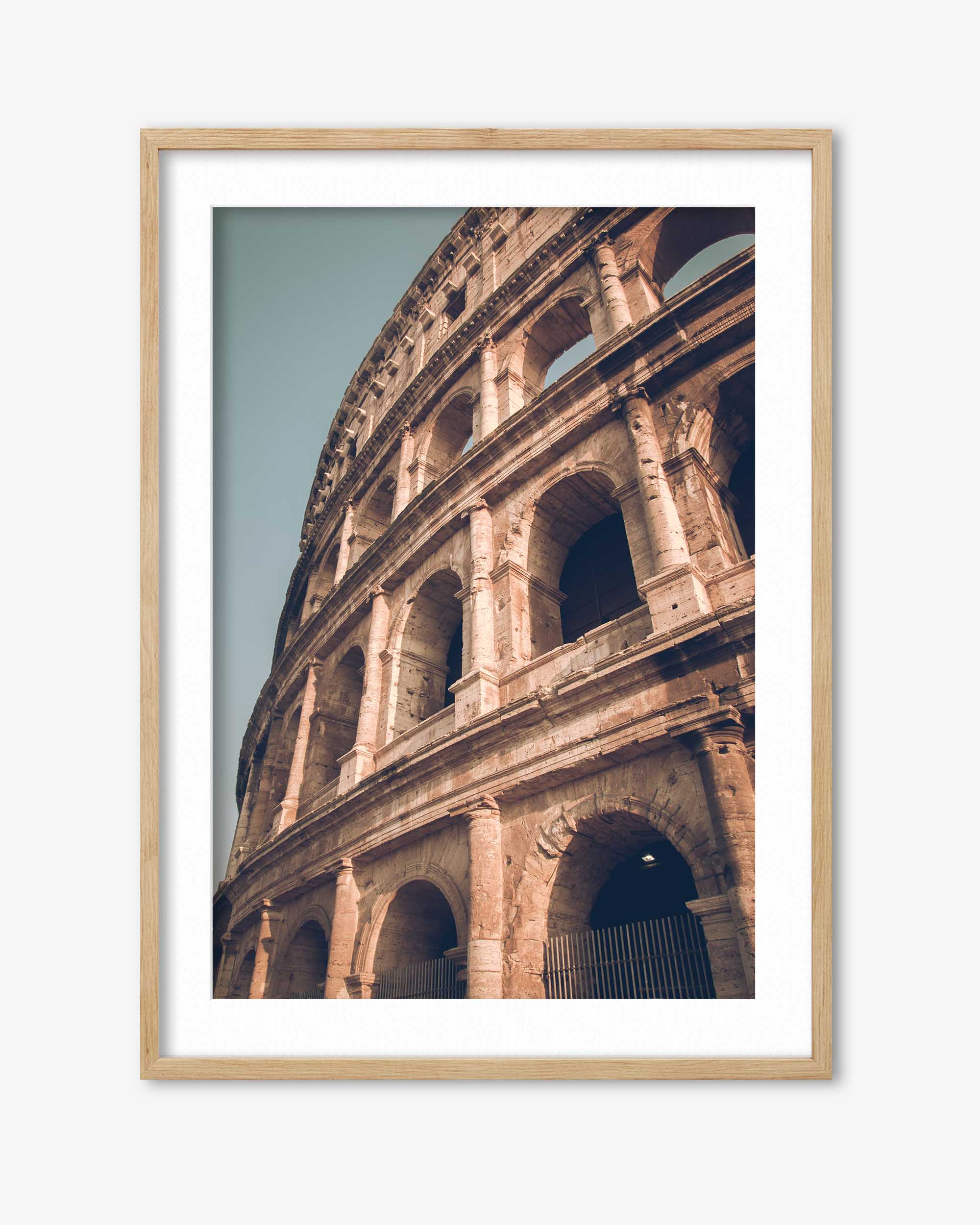Framed photograph of the Colosseum in Rome with a wooden frame.