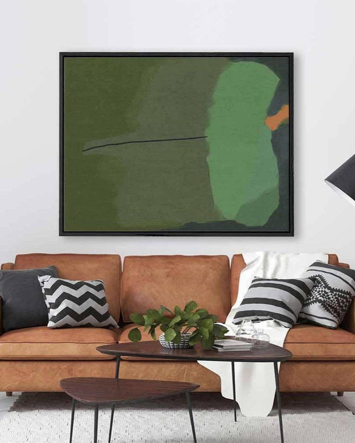 Modern living room with a brown leather sofa, abstract art, and decorative pillows.