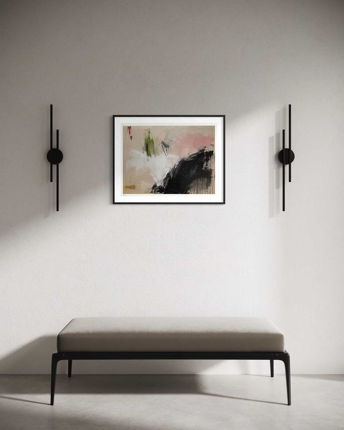 An abstract framed wall art print hangs on a light gray wall above a minimalist bench, flanked by two black wall sconces. The artwork features black, white, beige, and soft pink brushstrokes.