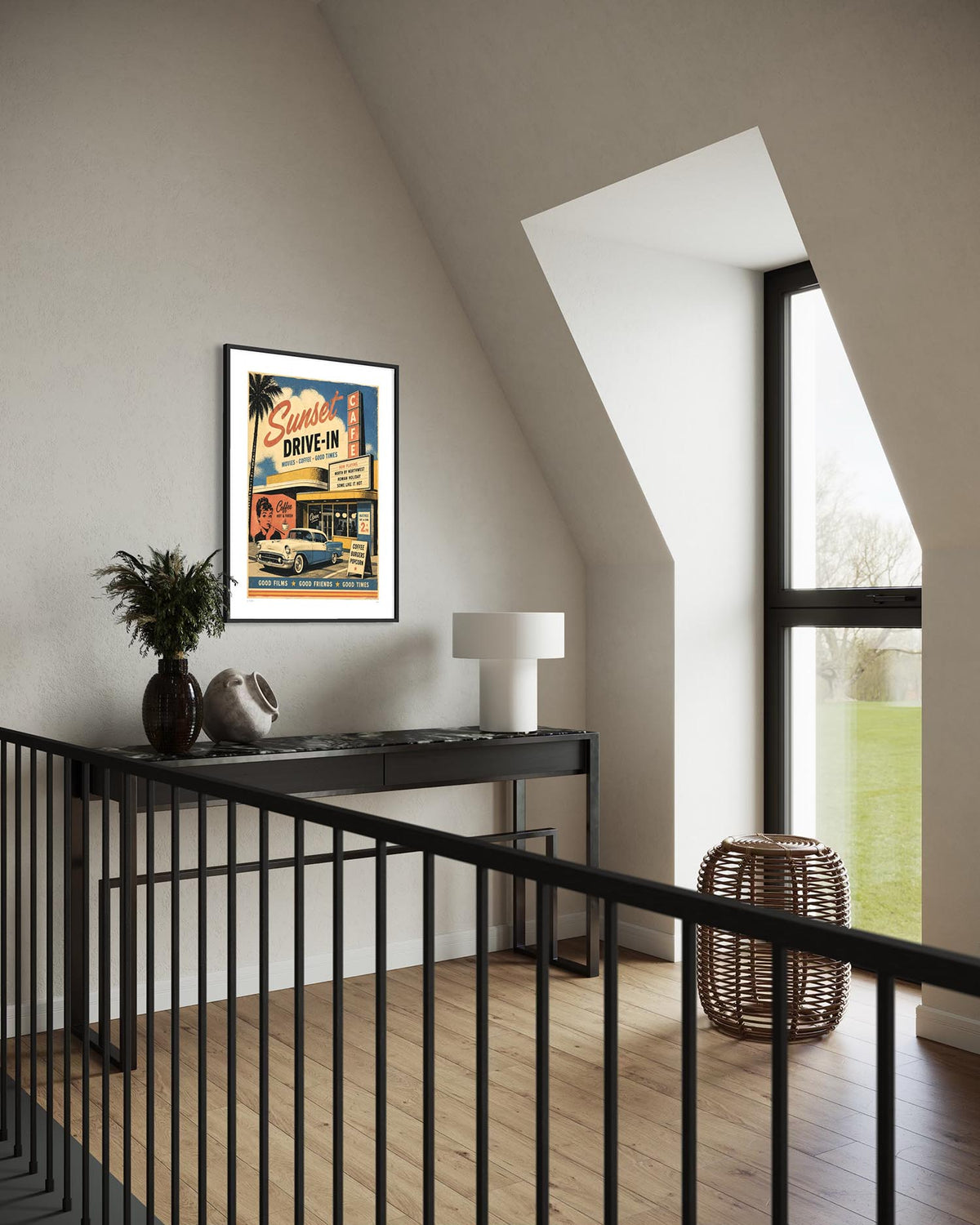 A framed vintage-style poster reading 'Carmen Drive-In' hangs on a beige wall in a modern attic room with a slanted ceiling, black railing, wood floor, and a large window.