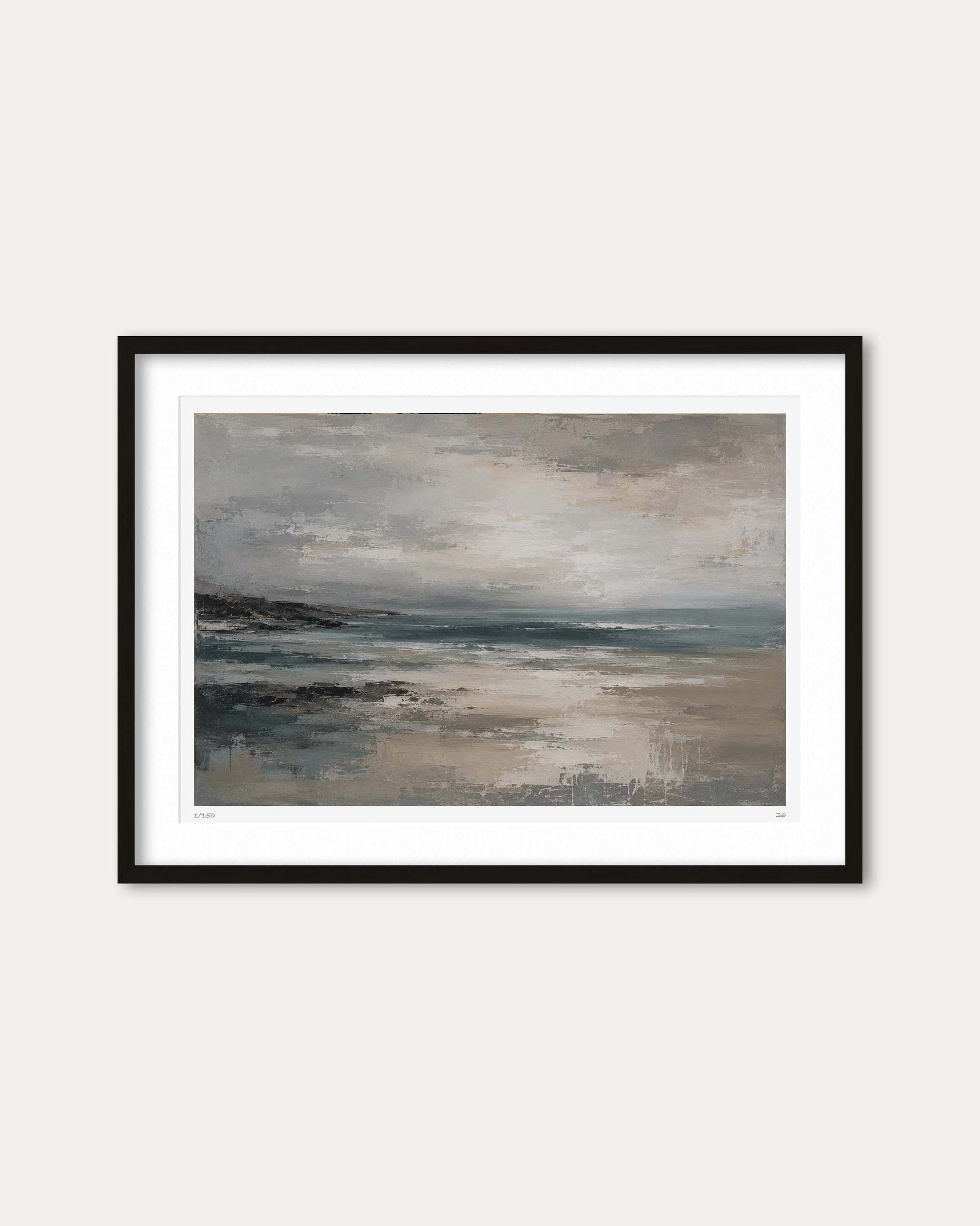 A framed landscape art print featuring an abstract depiction of a misty beach or coastal scene in muted gray, beige, and blue tones, presented with a white mat and a thin black frame against a light beige wall.
